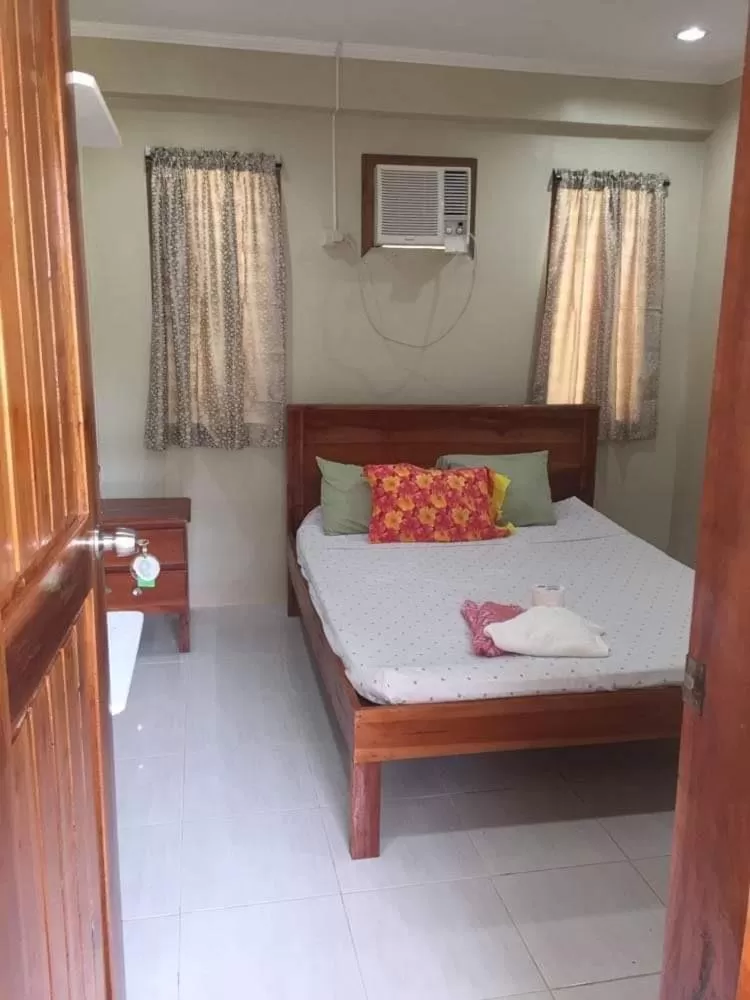 Bed in D's Oceanview Beach Resort