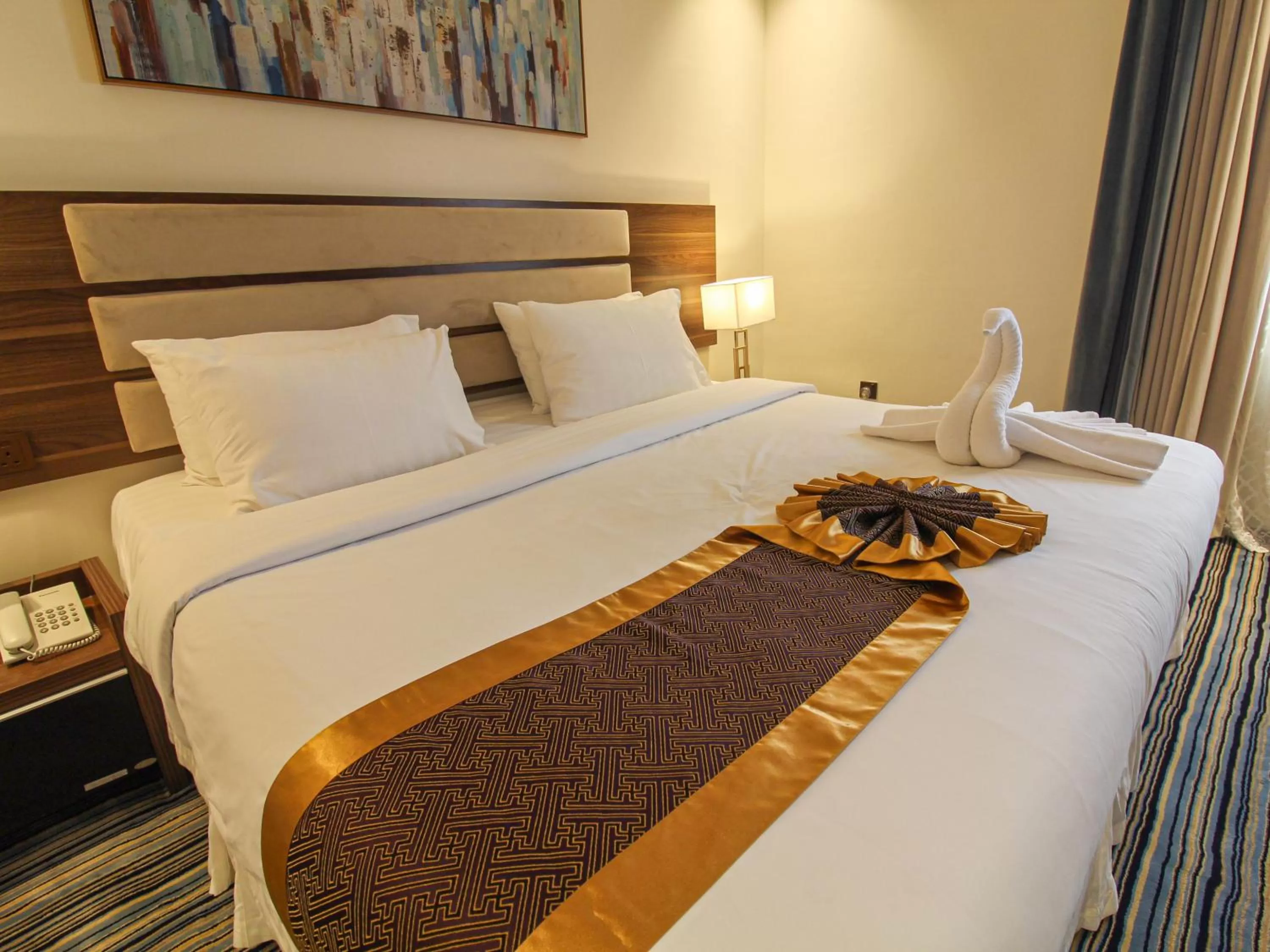 Bed in Friesian Hotel Suites