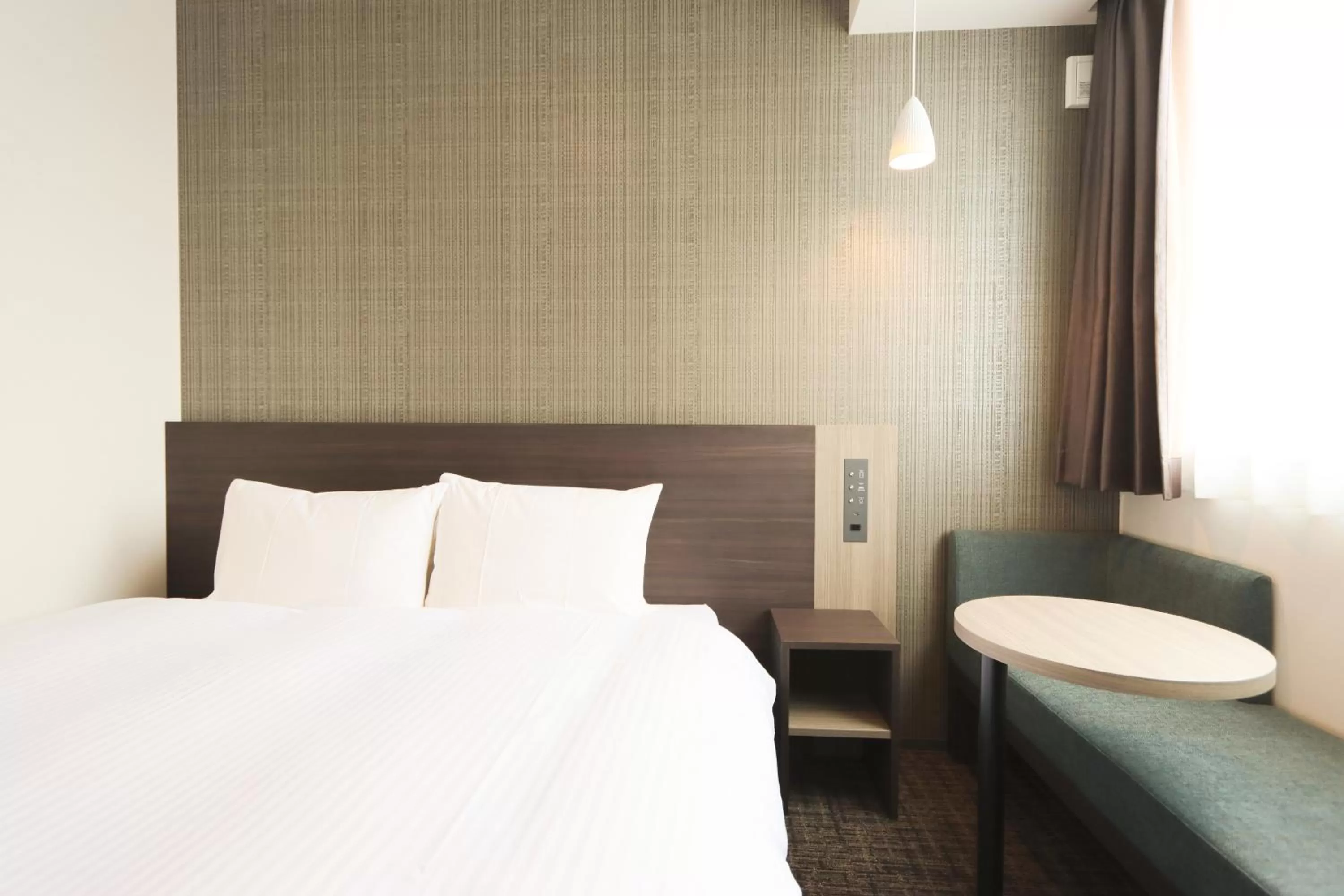 Bed in Wander Kyoto Nanajo