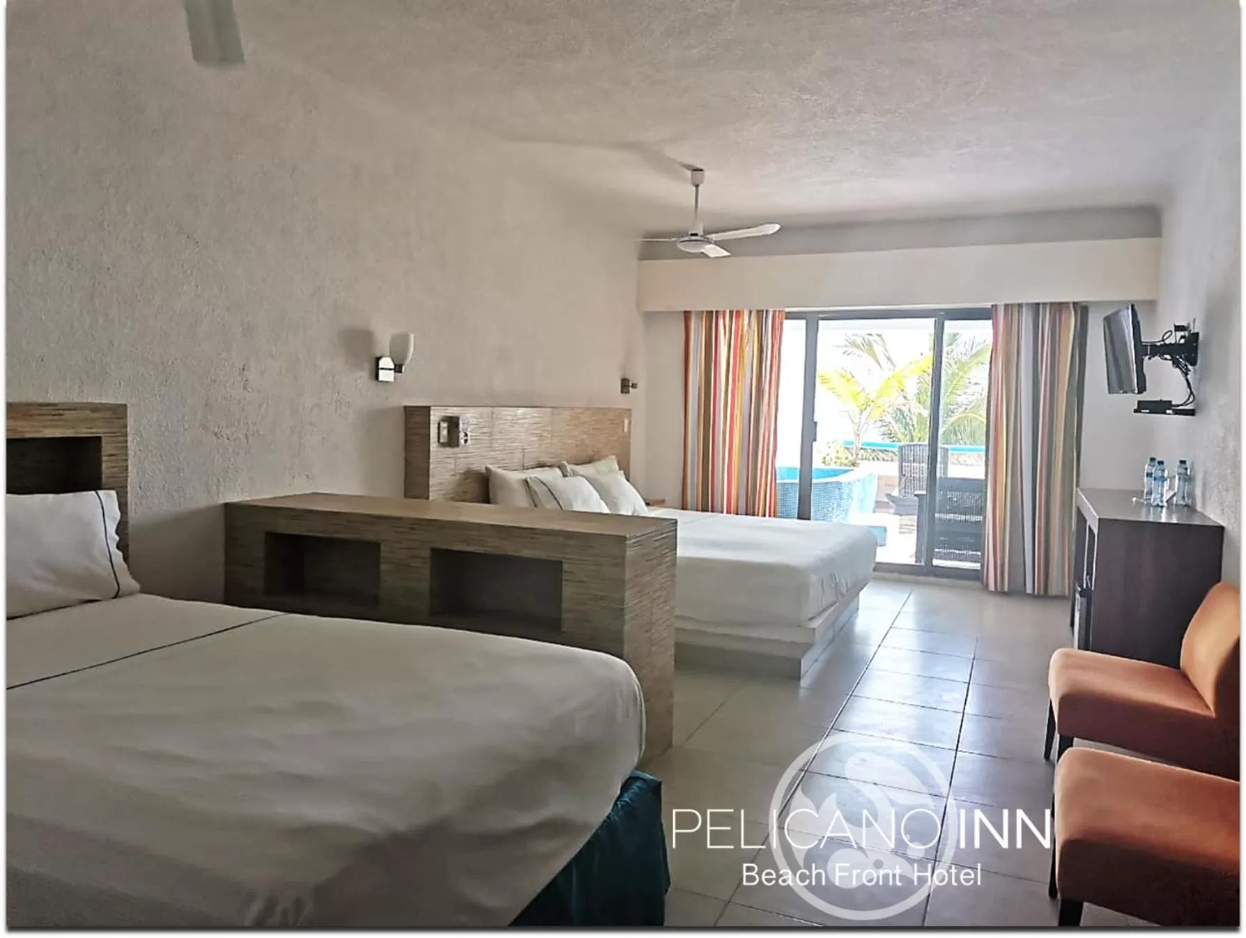 Photo of the whole room, Bed in Pelicano Inn Playa del Carmen - Beachfront Hotel