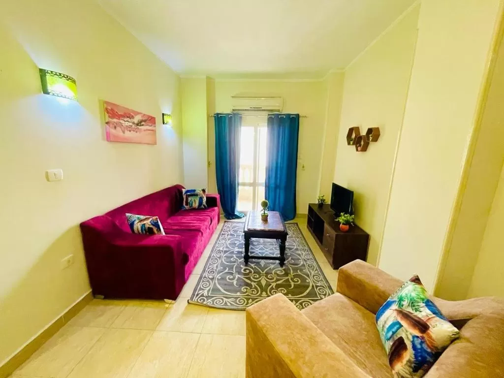 Communal lounge/ TV room, Seating Area in Charbel apartments