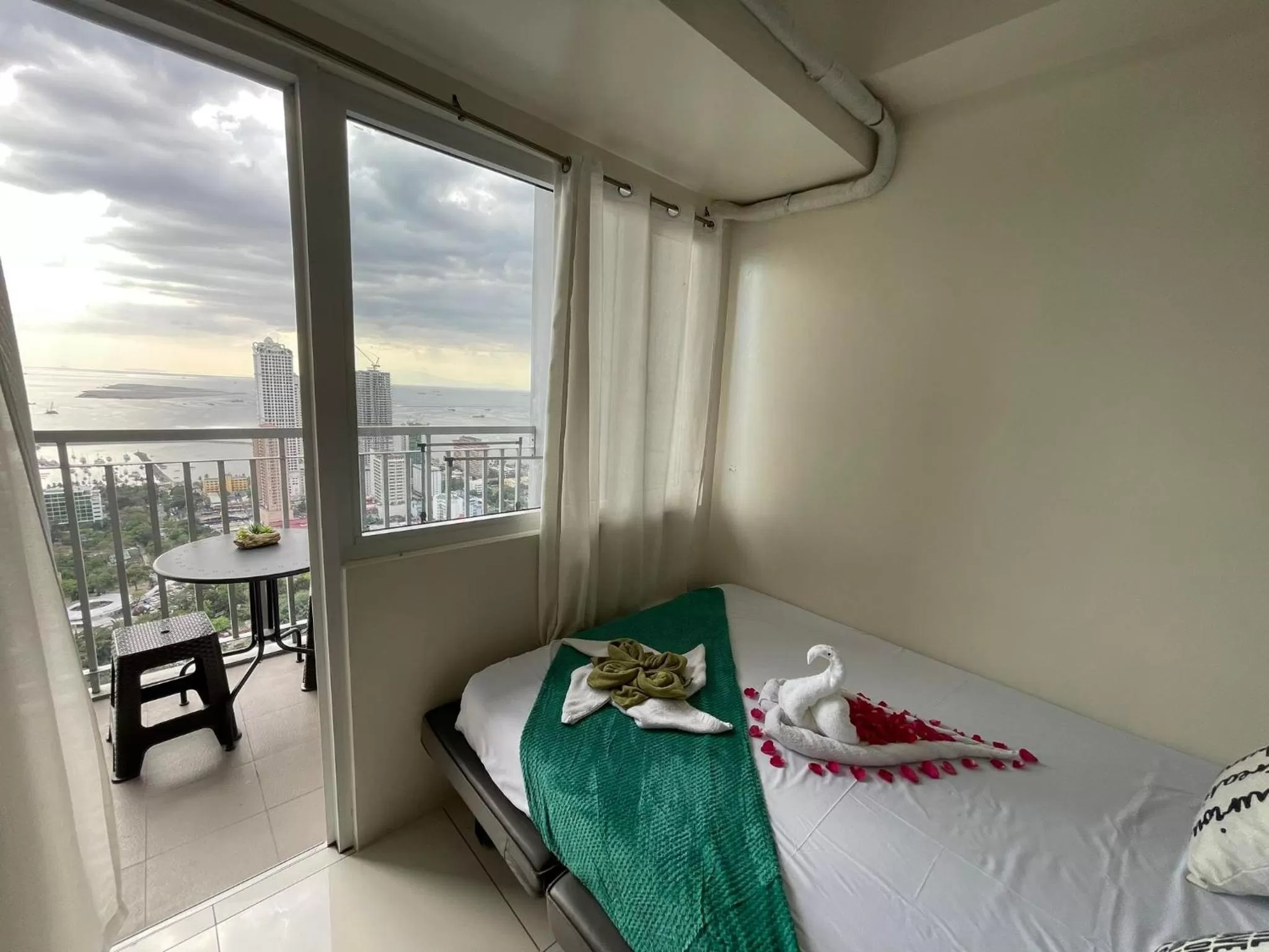 Bed in Green Residences Stays by PBYY