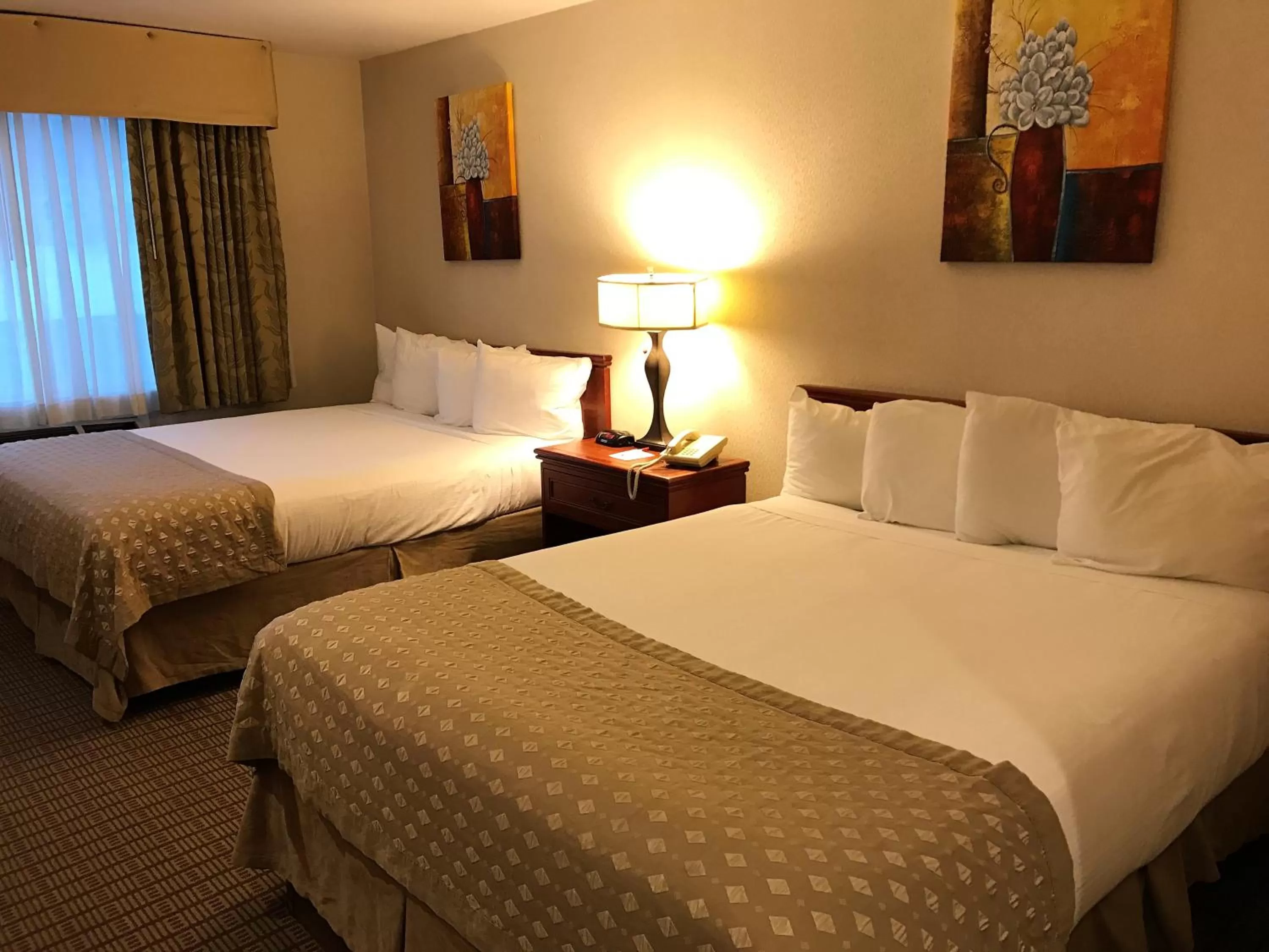 Photo of the whole room, Bed in Ramada by Wyndham Draper, Utah