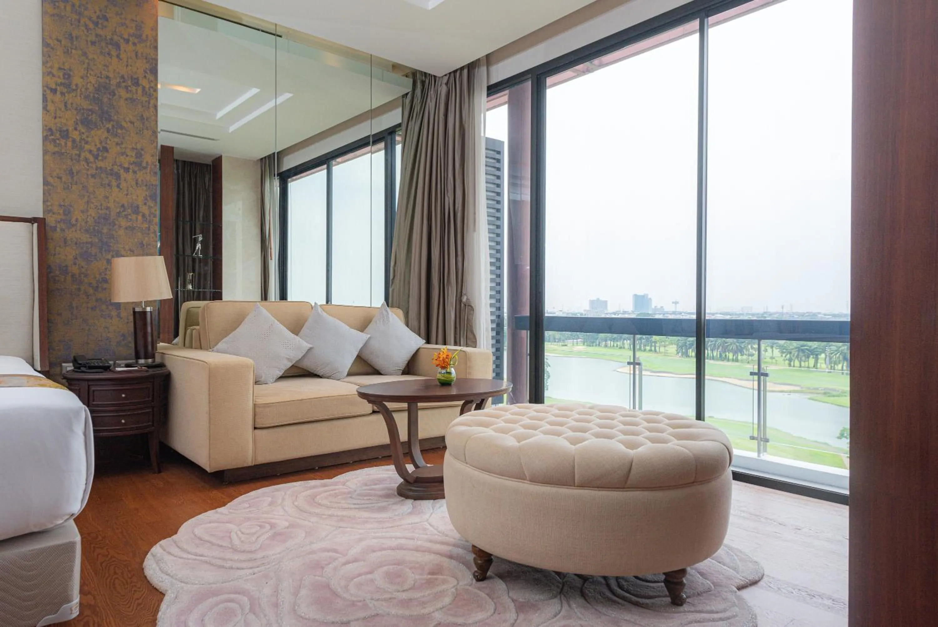 Living room in Summit Windmill Golf Suite Hotel at Suvarnabhumi