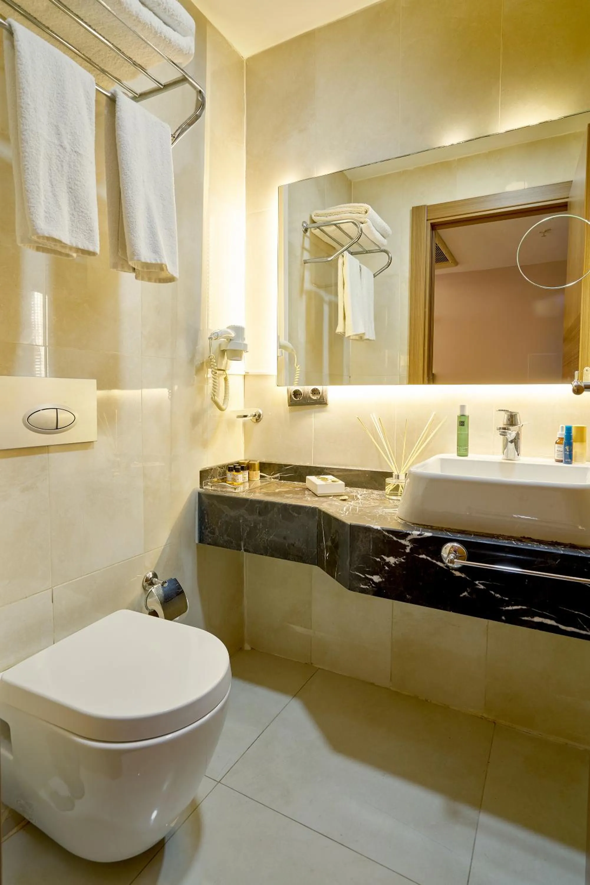 Toilet in Atro Hotel