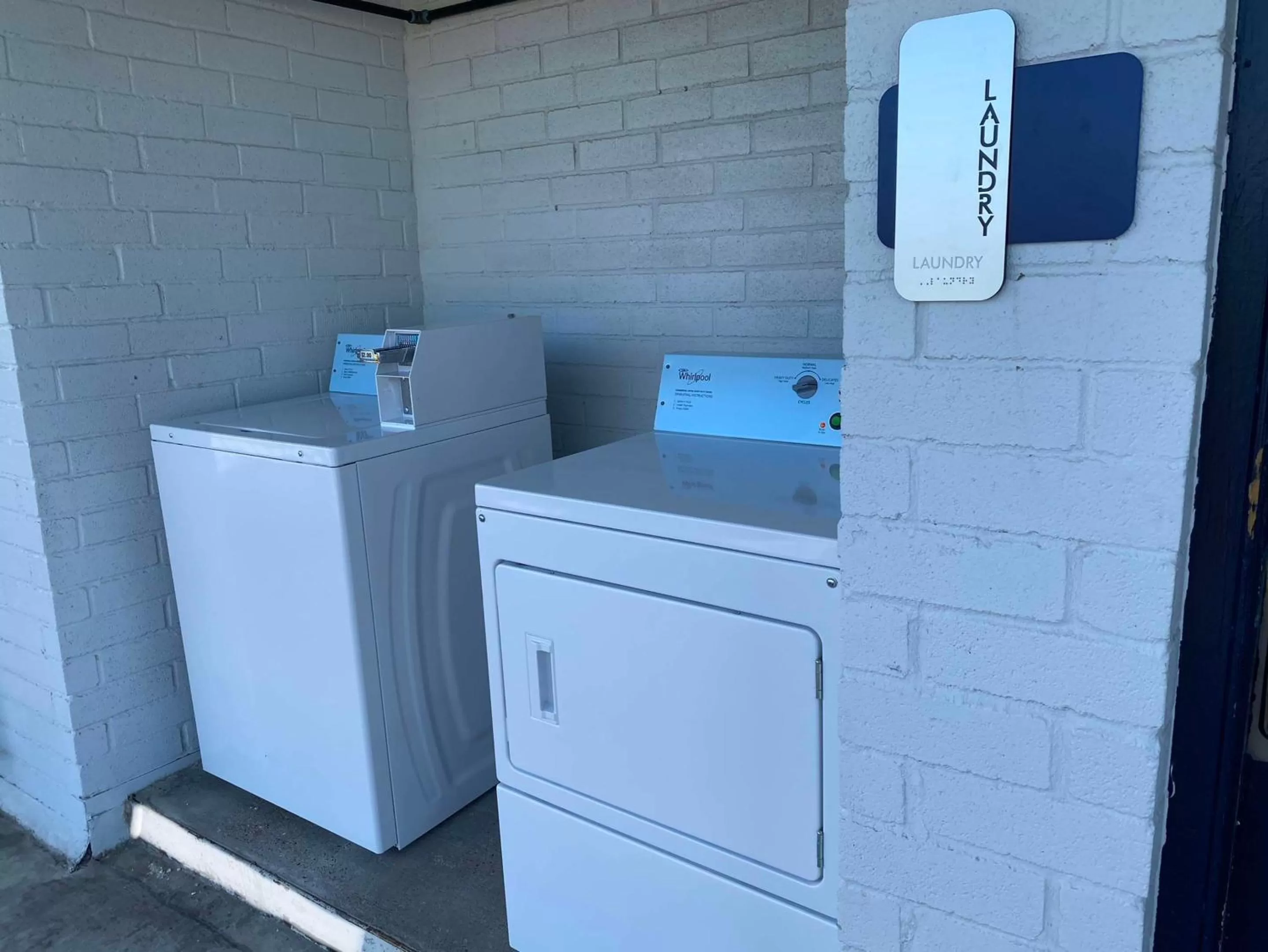 laundry in SureStay Hotel by Best Western Spring North Houston