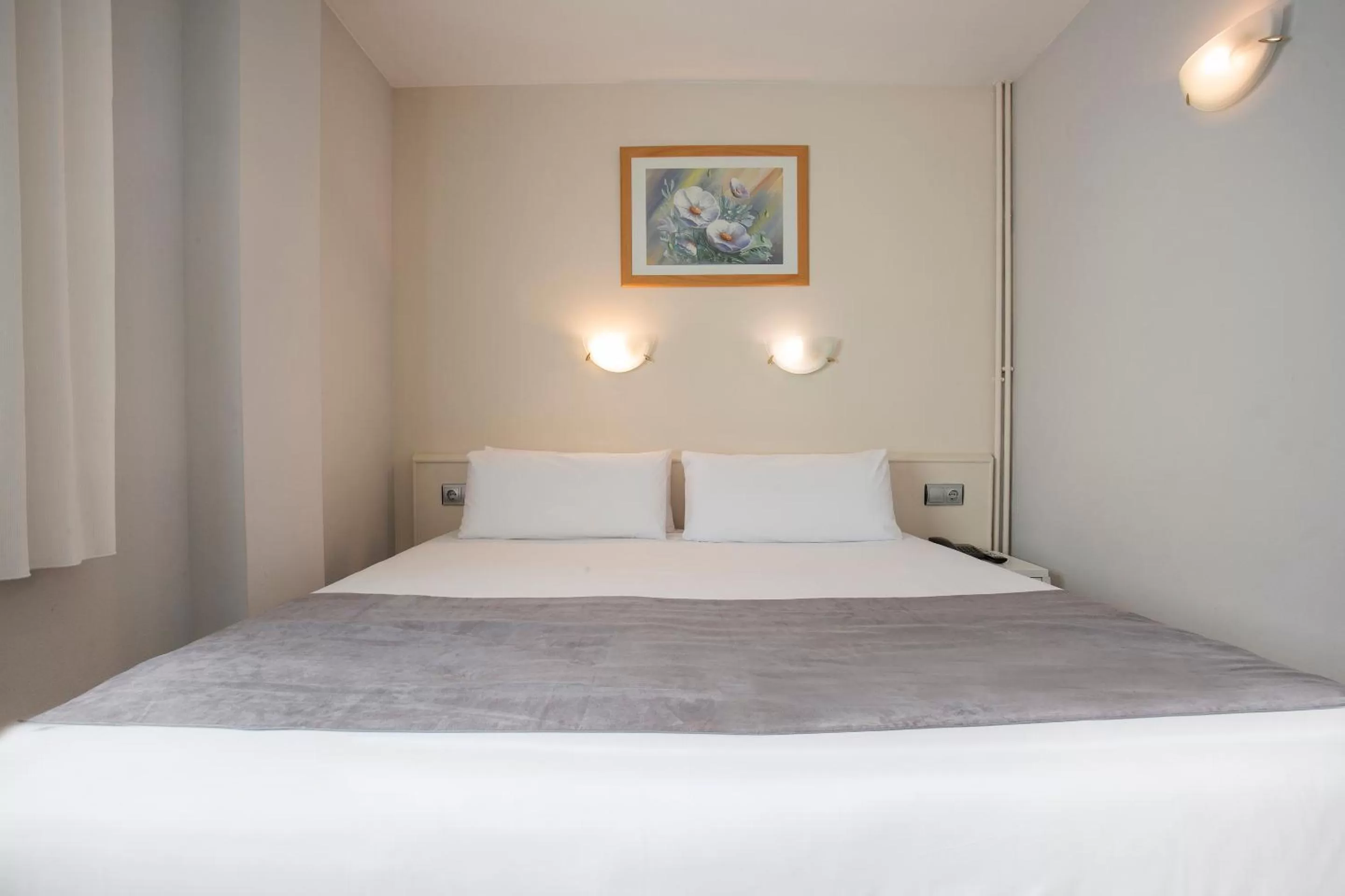 Bed in Hotel Camellot by Nexta