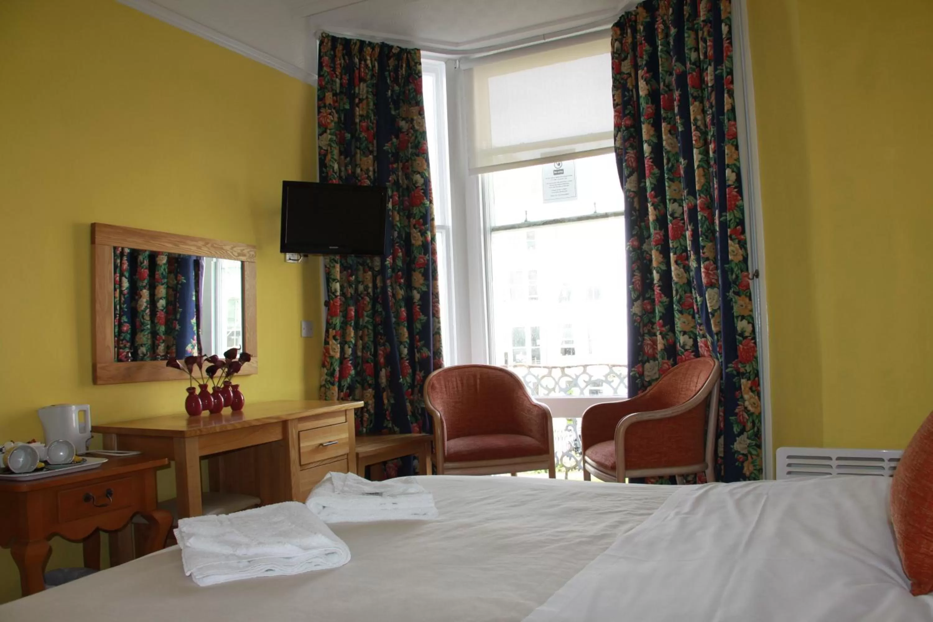 Bed in Ambassador Hotel