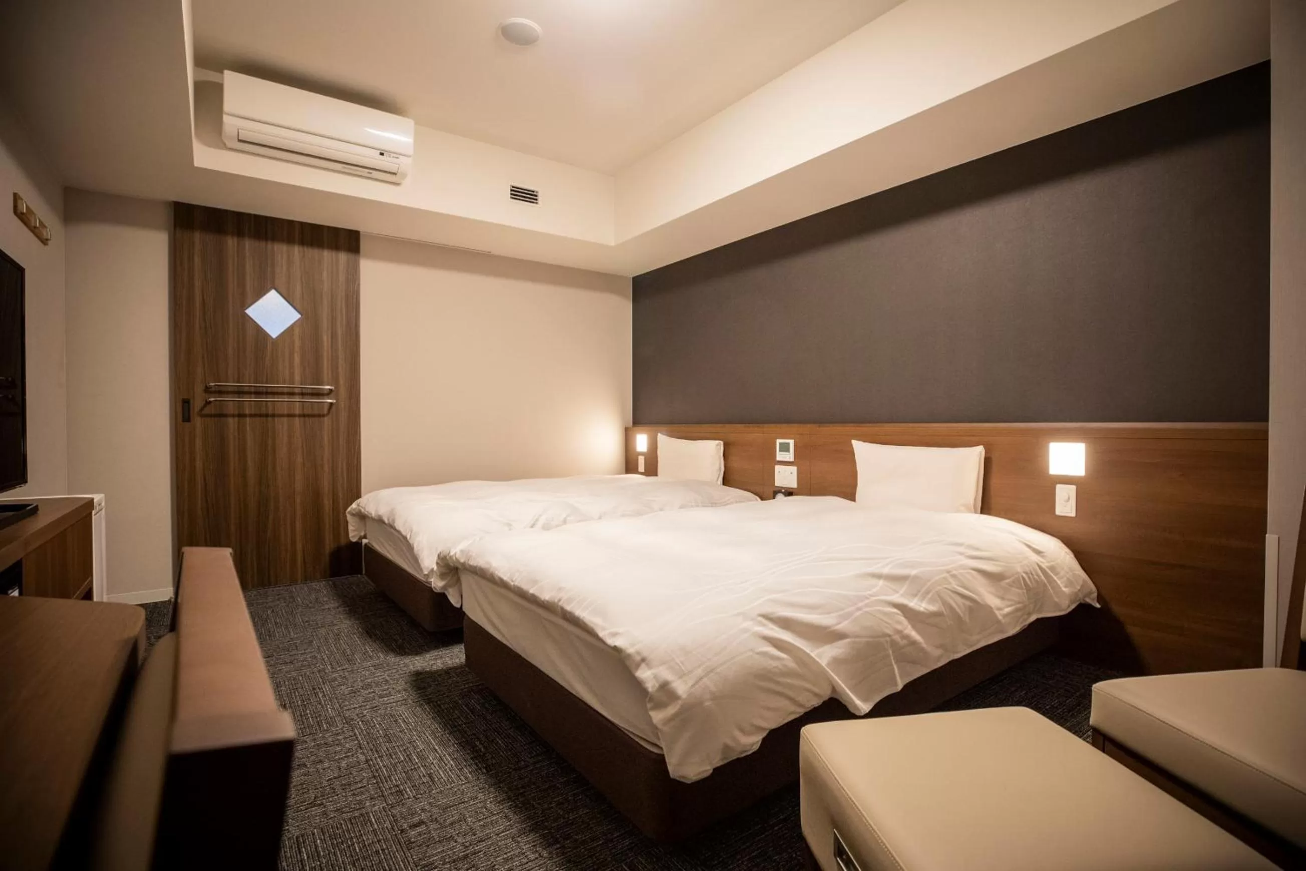 Photo of the whole room, Bed in La Vista Furano Hills Natural Hot Spring