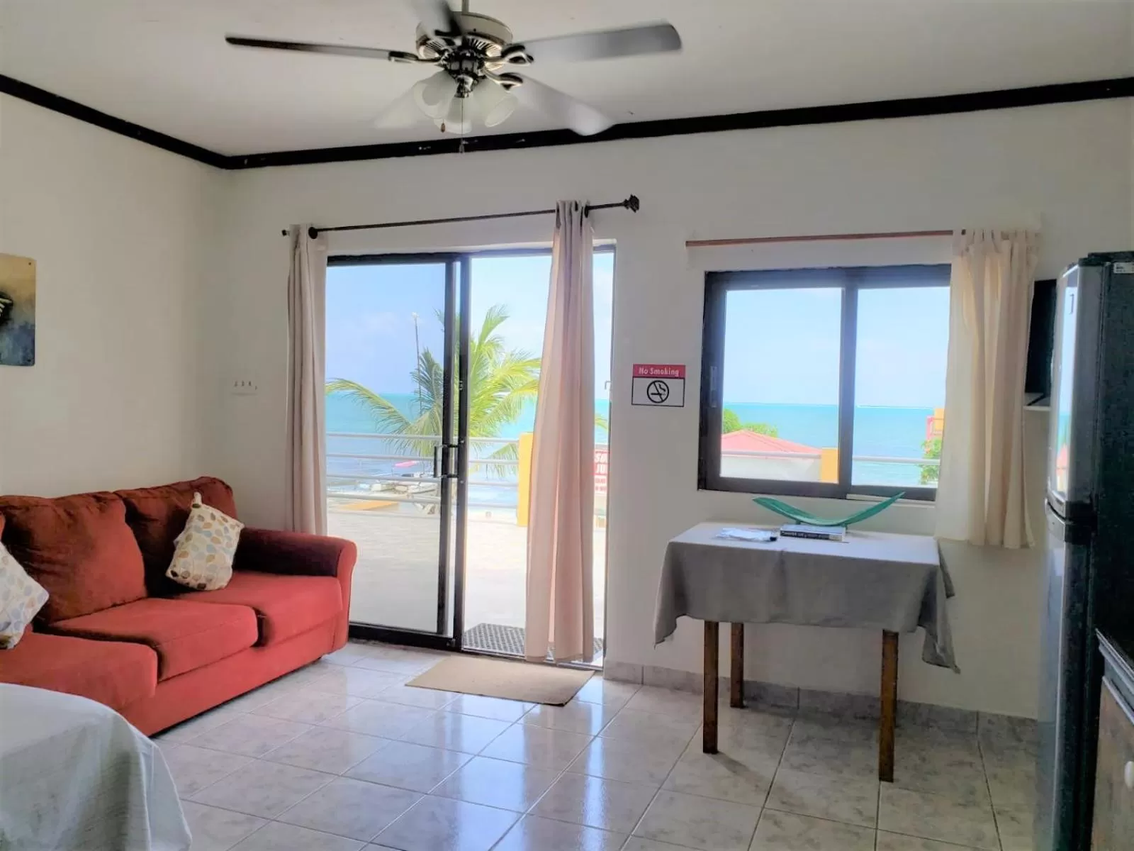 Seating Area in Beach Side Condos Caye Caulker by CCVH