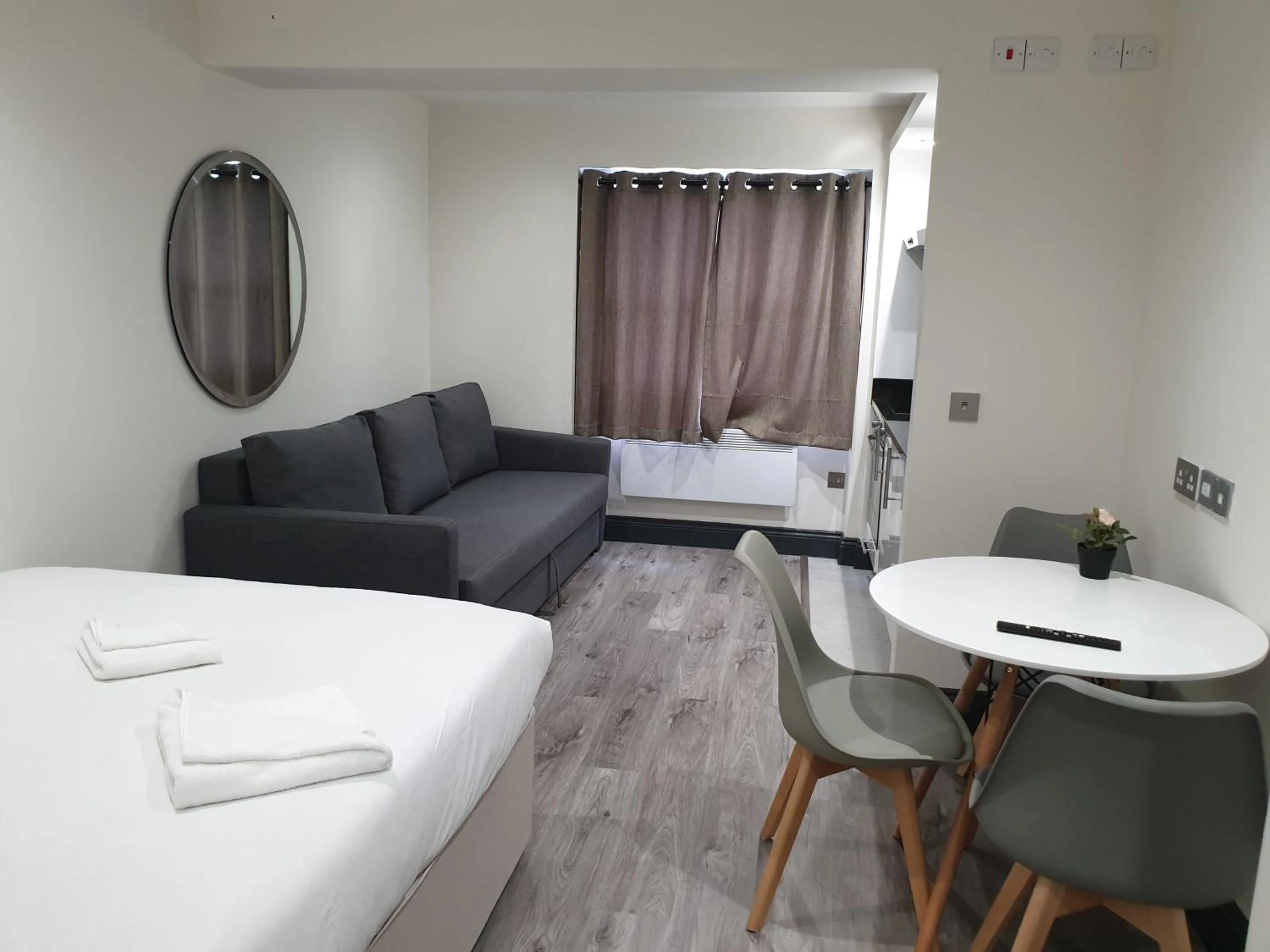 Seating area, Bed in Hyde Park Superior Apartments