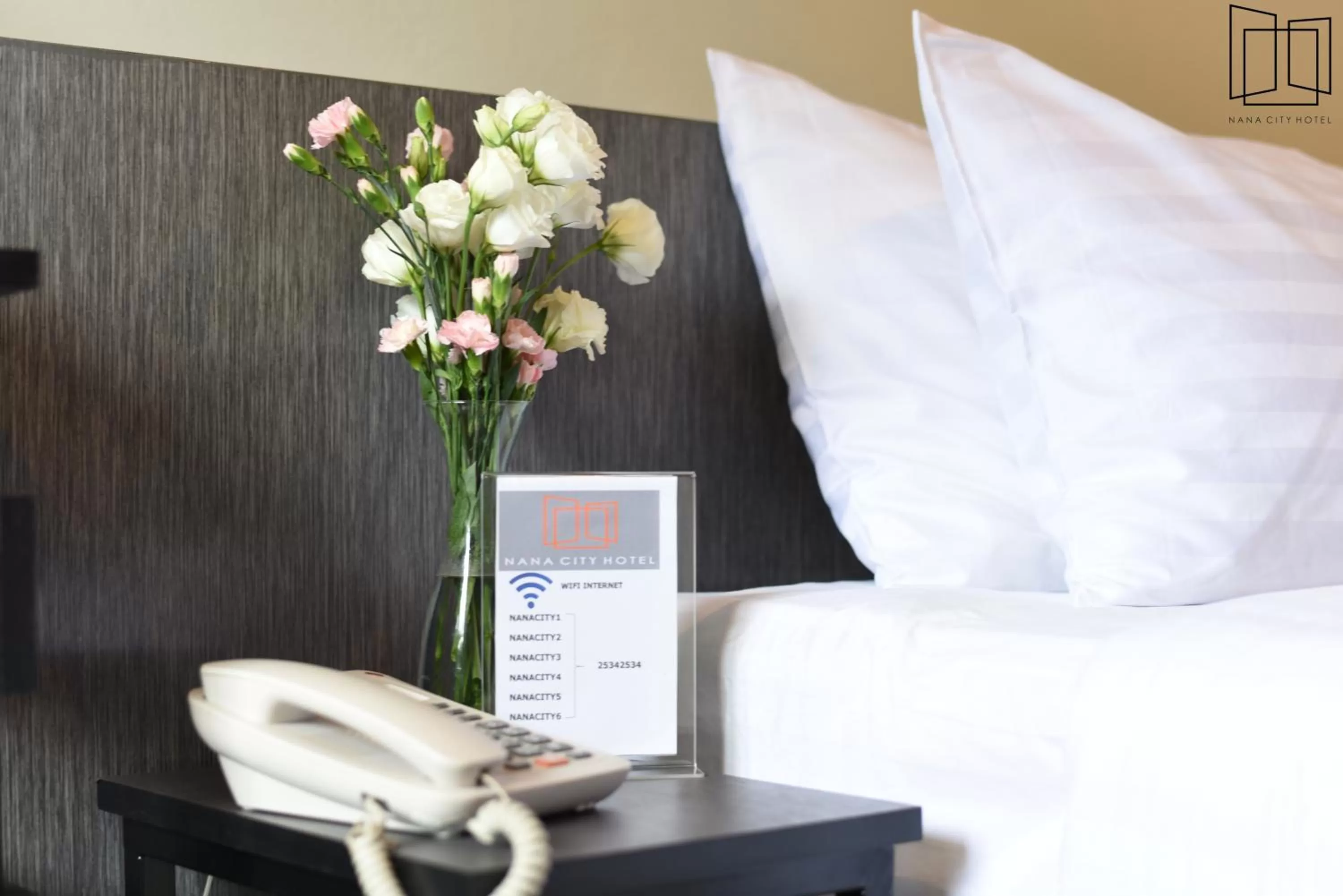 Bed in Nana City Hotel