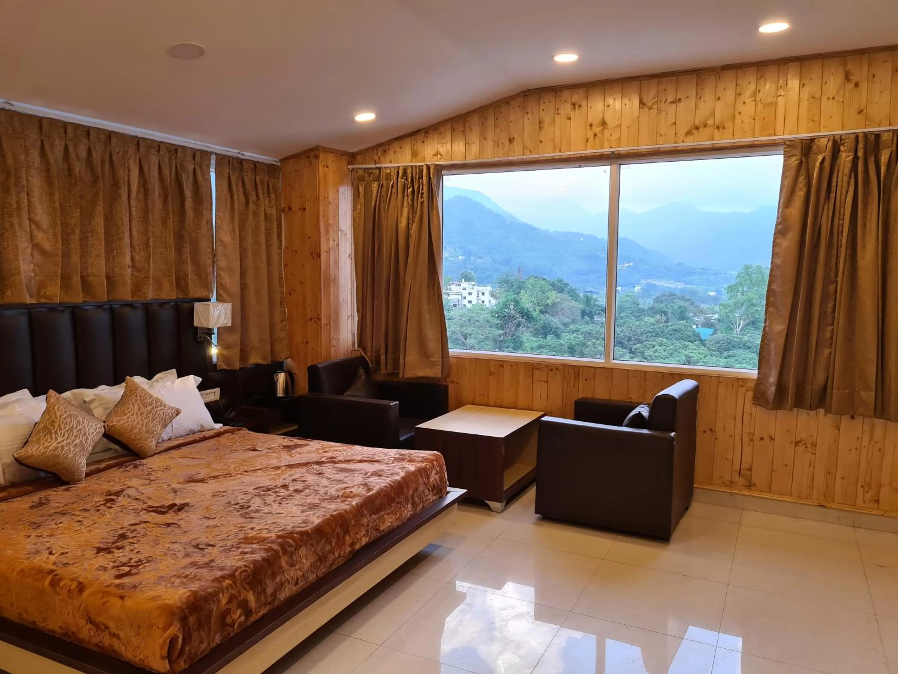 Photo of the whole room, Bed in Hotel Rajpur Heights