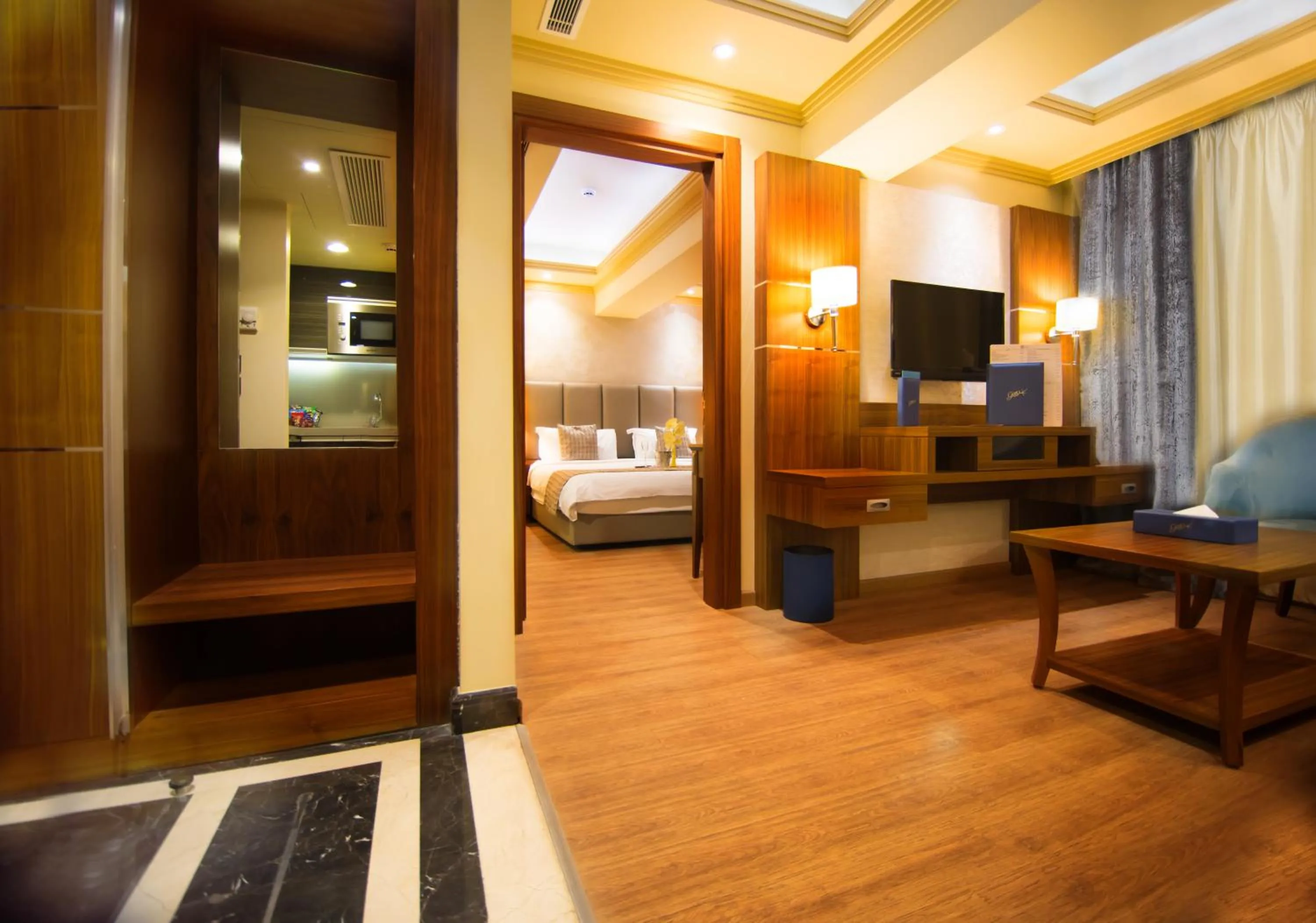 Living room, Bed in Gems Hotel