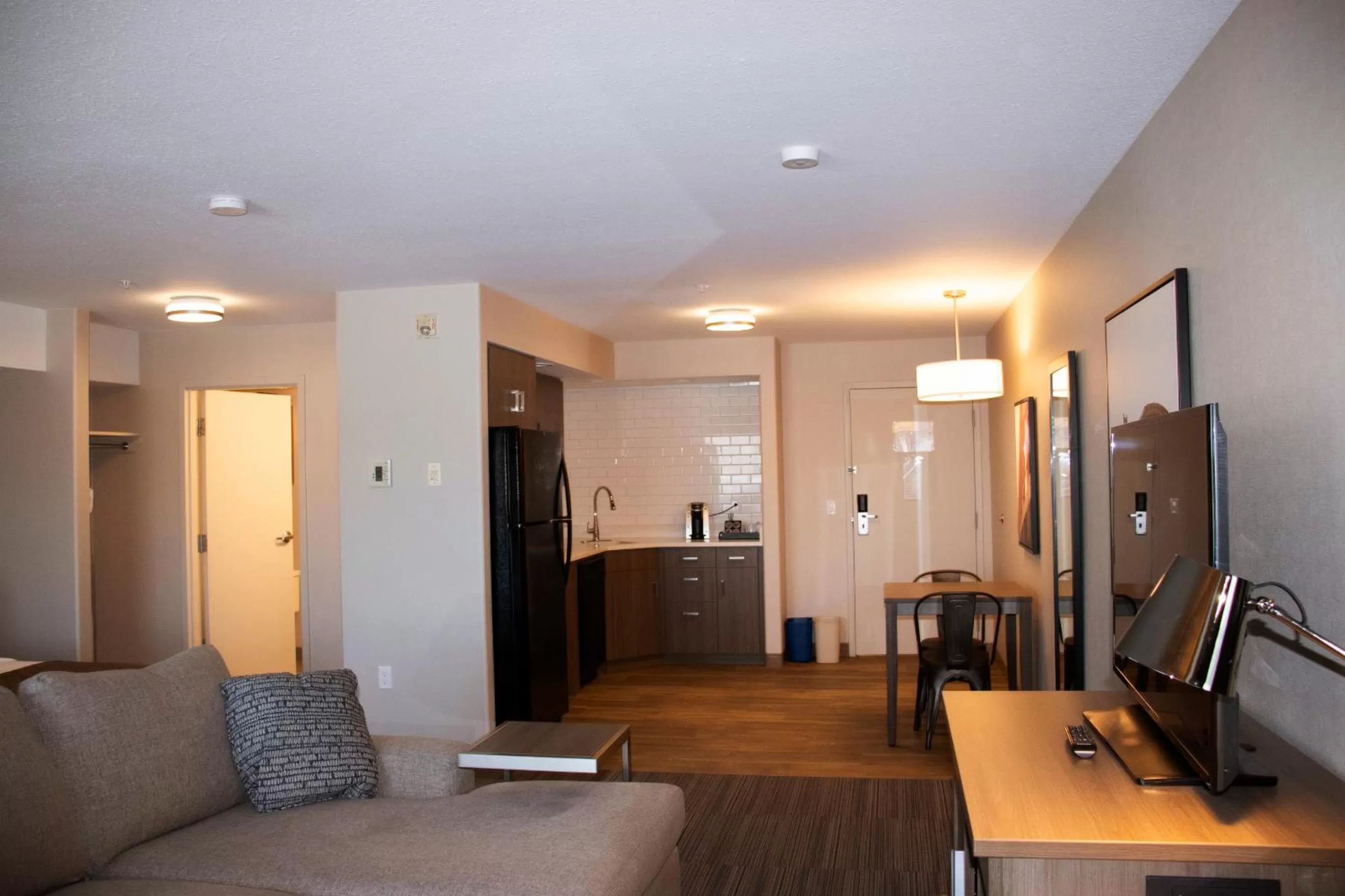 Kitchen or kitchenette in Ramada by Wyndham Airdrie Hotel & Suites