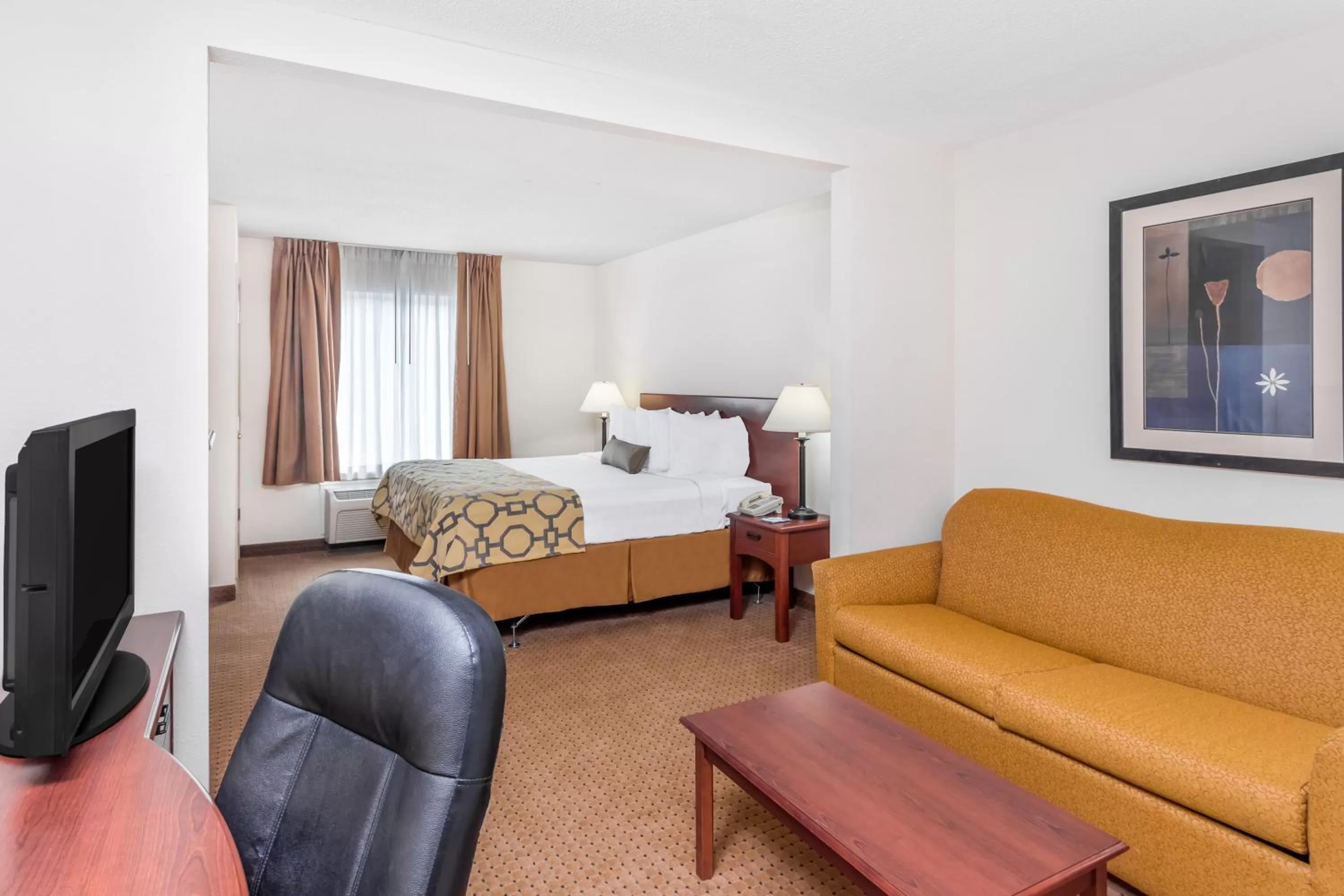 Living room, Bed in Baymont by Wyndham Cartersville