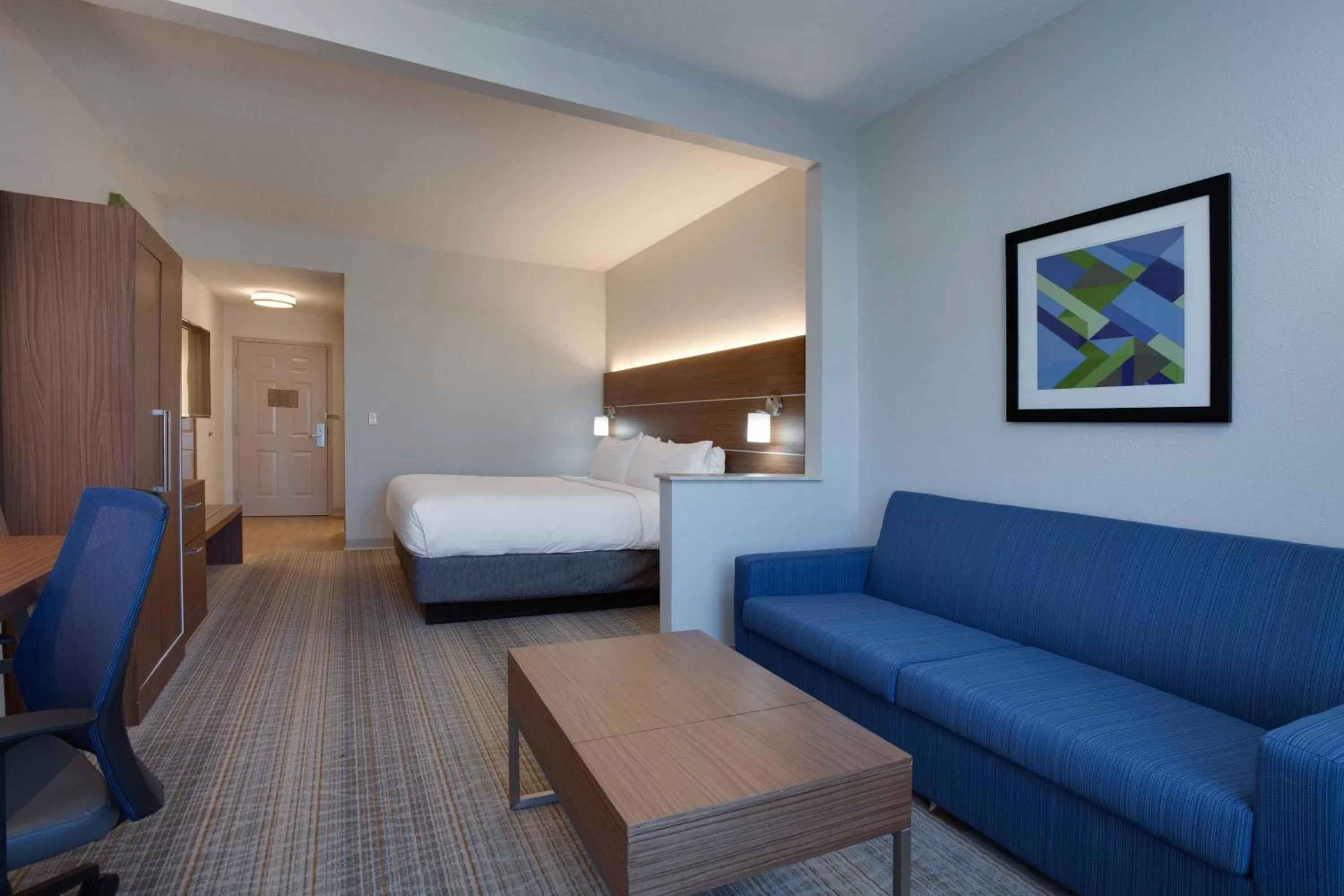 Living room, Bed in Holiday Inn Express & Suites Orlando International Airport by IHG