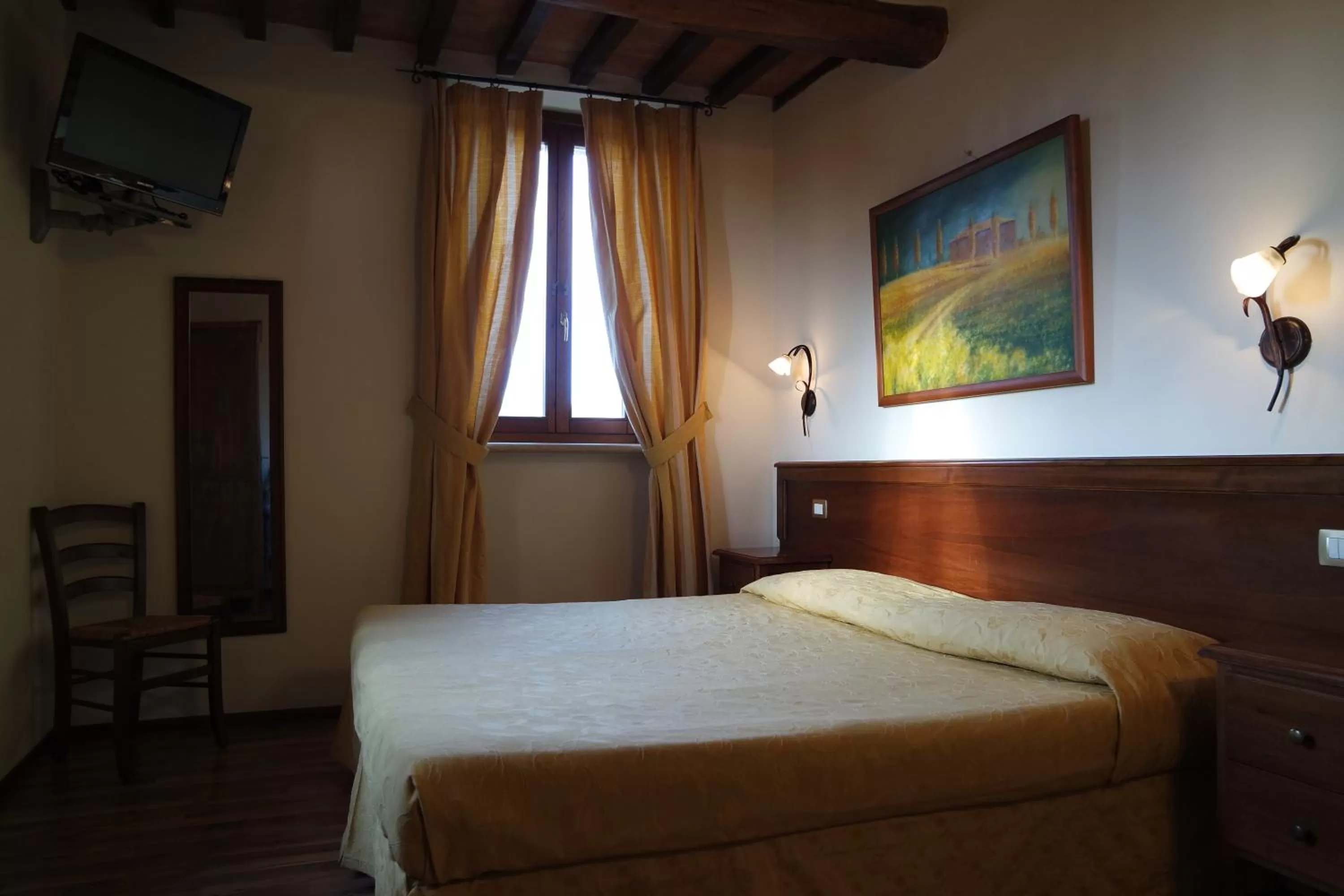 Photo of the whole room, Bed in Fonte Dei Tufi