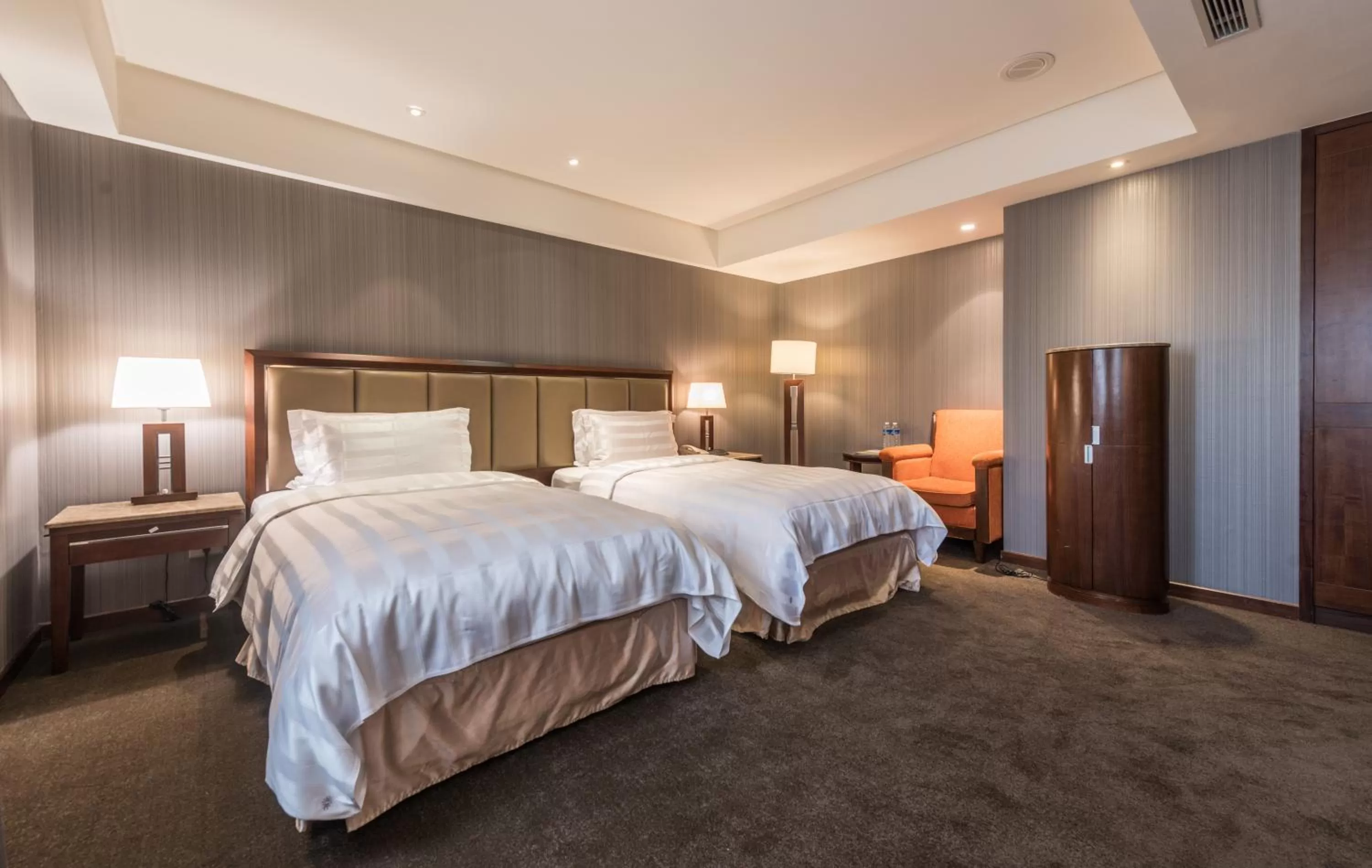 Bed in Royal Biz Taipei Hotel