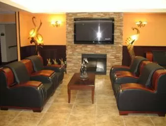 Communal lounge/ TV room in Days Inn by Wyndham Athabasca