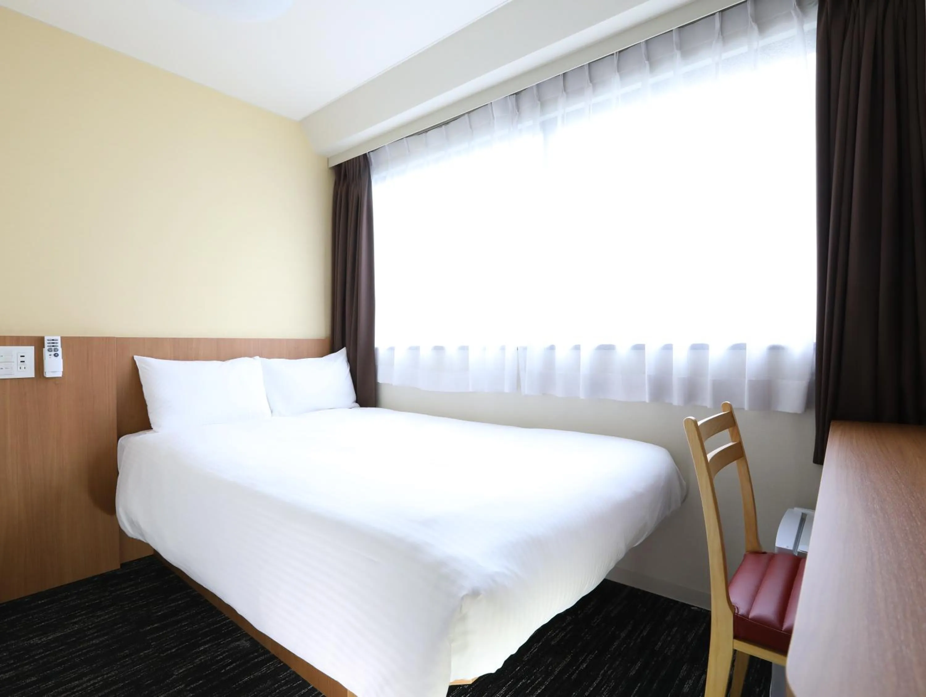 Photo of the whole room, Bed in Hotel Wing International Korakuen
