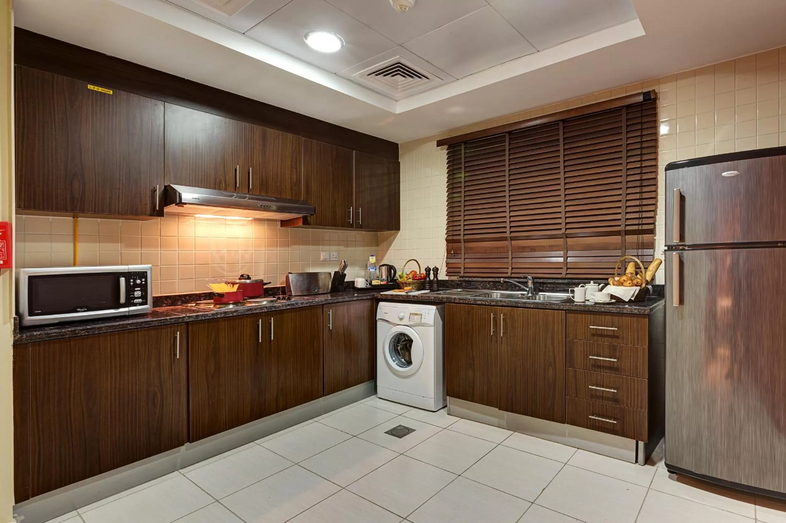 Kitchen or kitchenette in Abidos Hotel Apartment Dubai Land