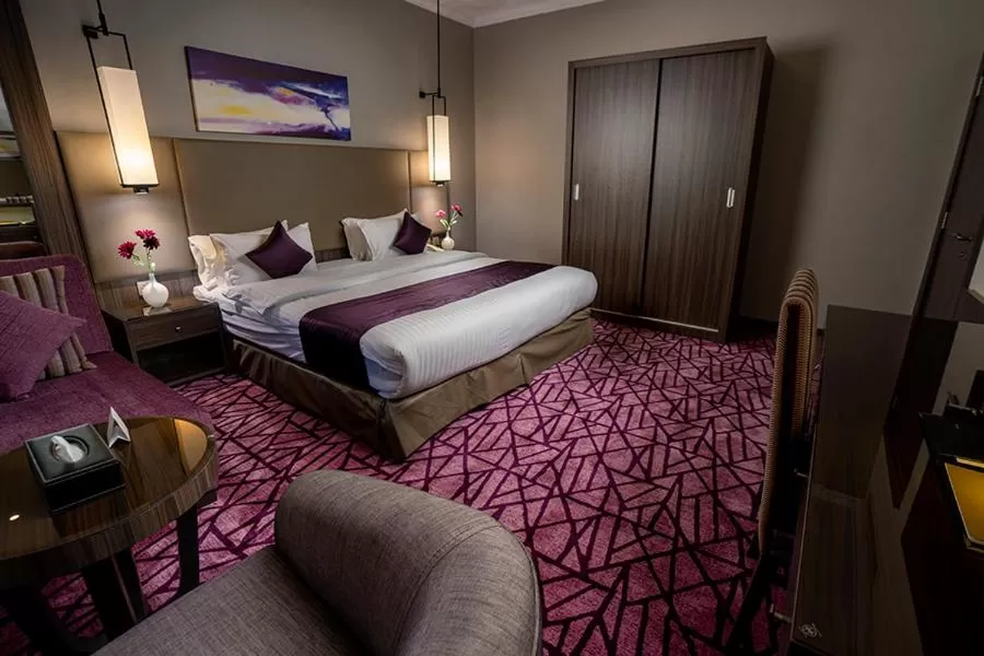 Bedroom in Aquila Al Hamra Hotel