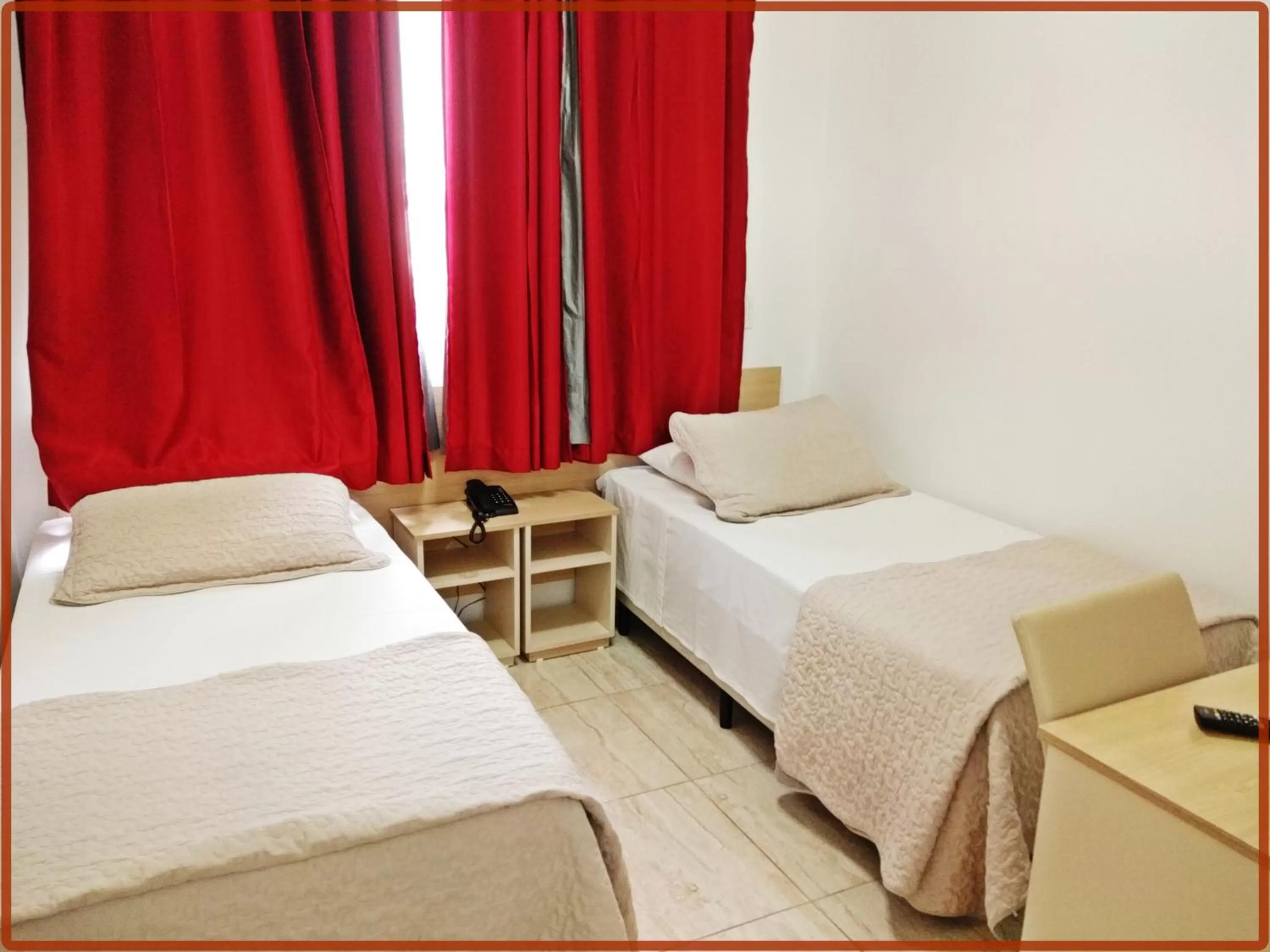 Bed in Hotel Anjos LTDA