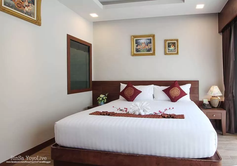 Bed in The Agate Pattaya Boutique Resort