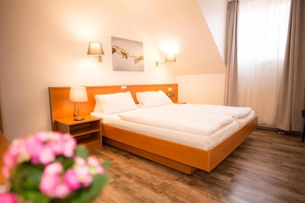 Bed in Hotel Weiße Mühle