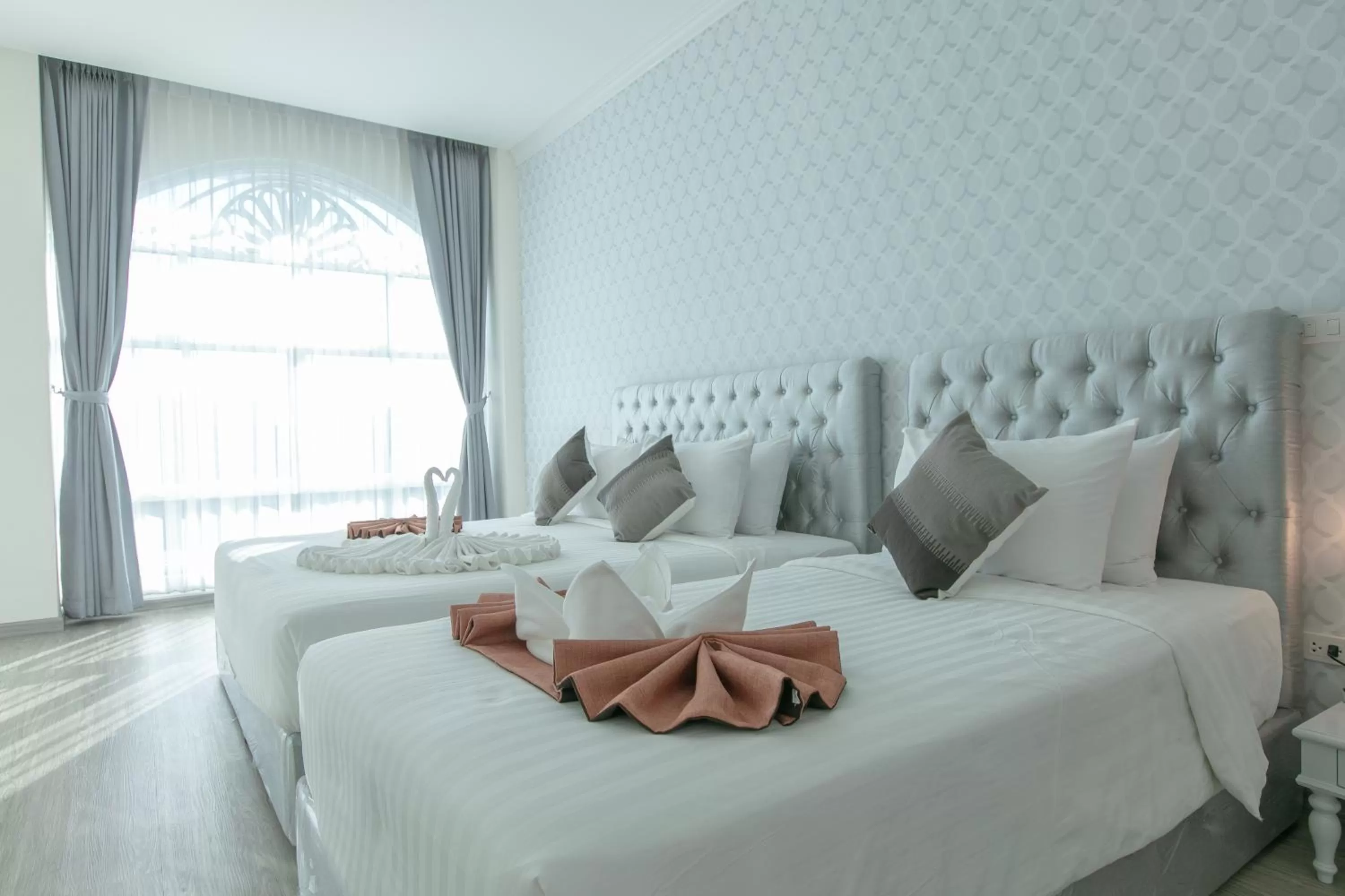 Bed in De Hug Hotel & Residence