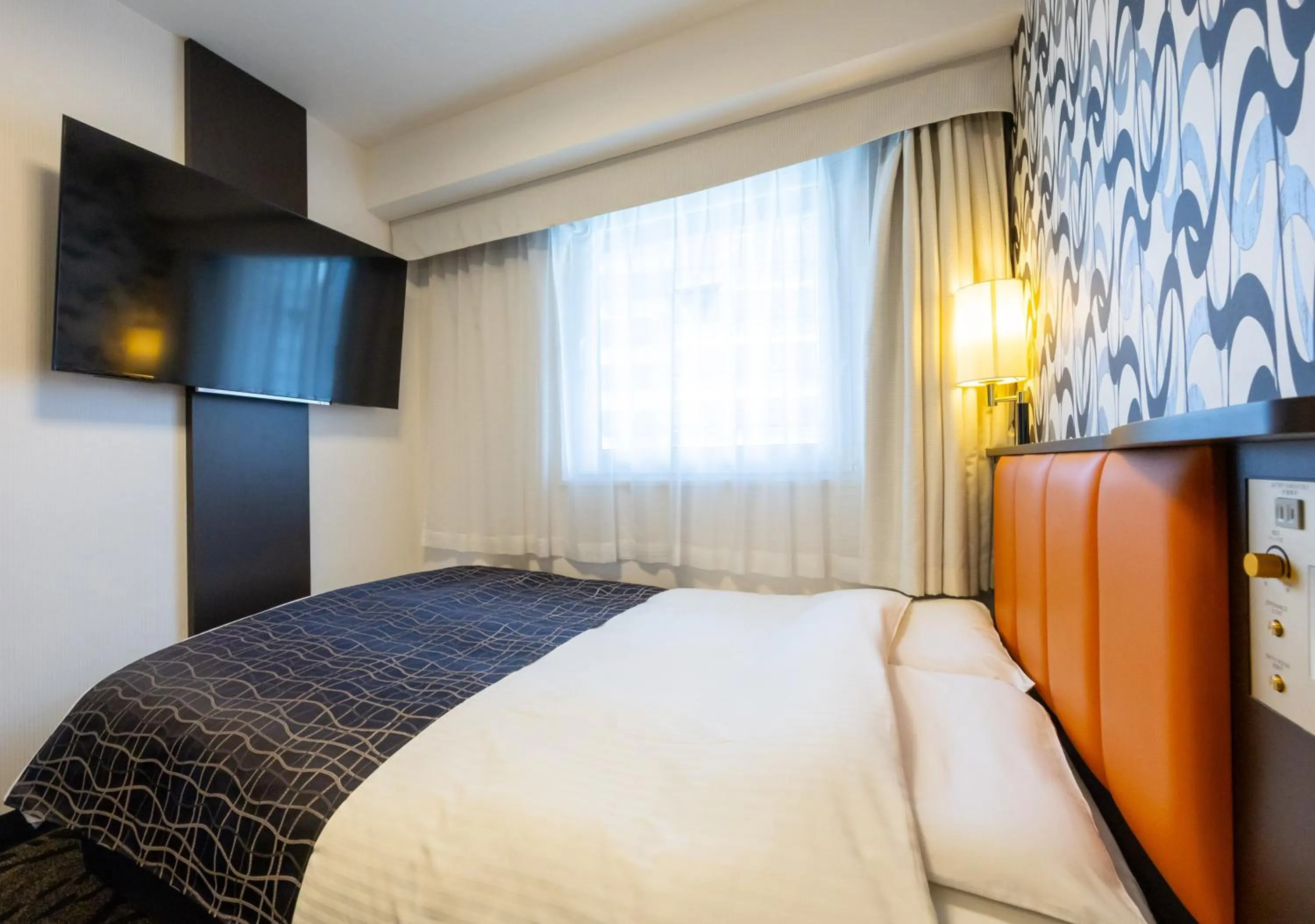 Bed in APA Hotel Osaka Umeda