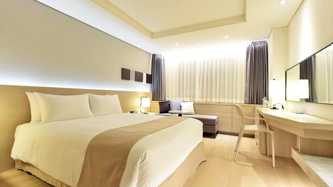 Bed in Pacific Hotel