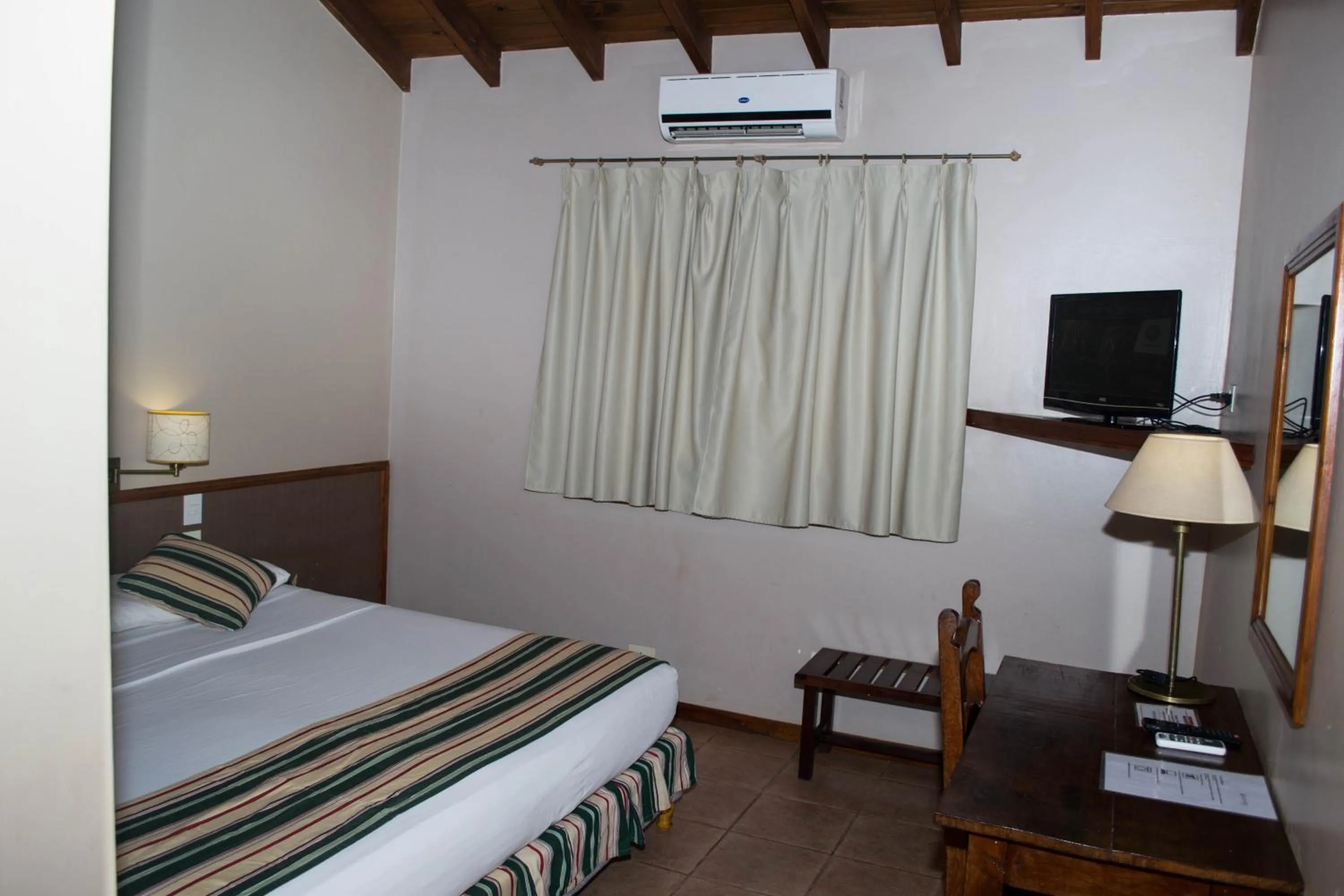 Bed in Marcopolo Suites Iguazu