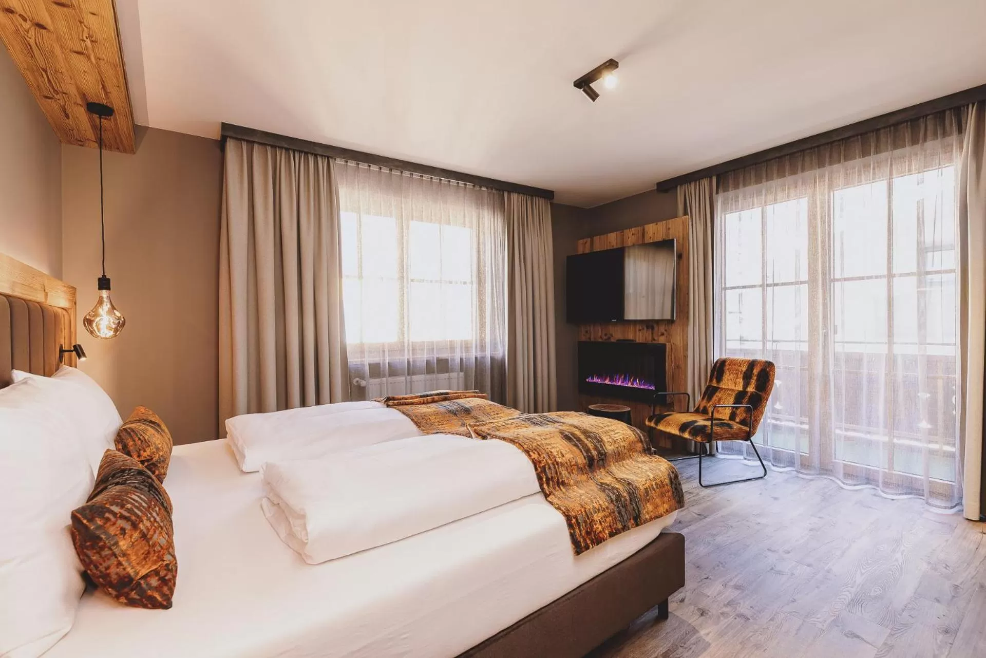 Photo of the whole room, Bed in POST POST Hotel - Alpine Boutique Hotel & Spa