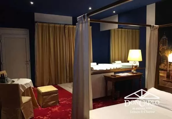 Bed in Hotel Don Carlo