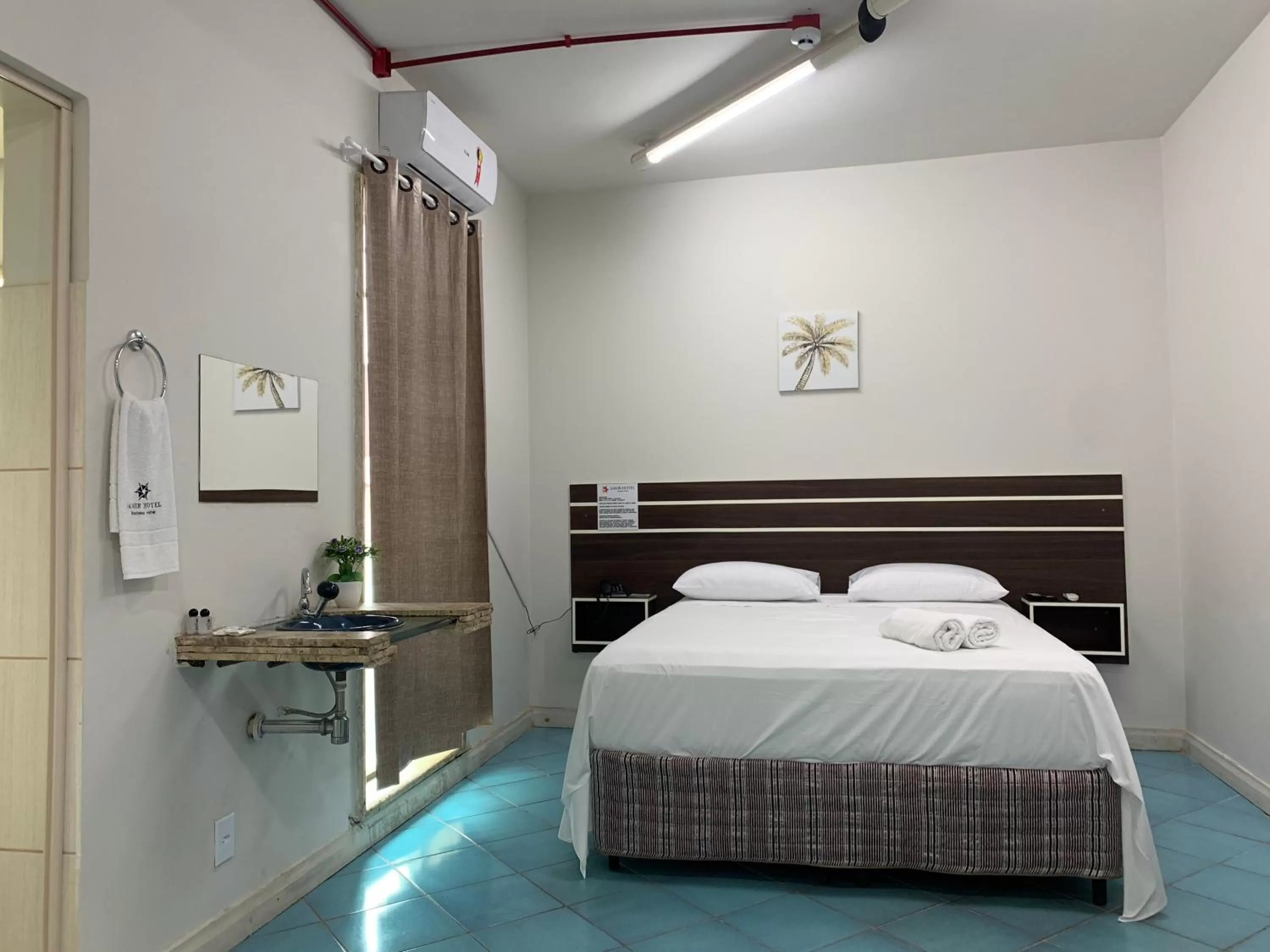 Bed in SAMIR HOTEL COMFORT