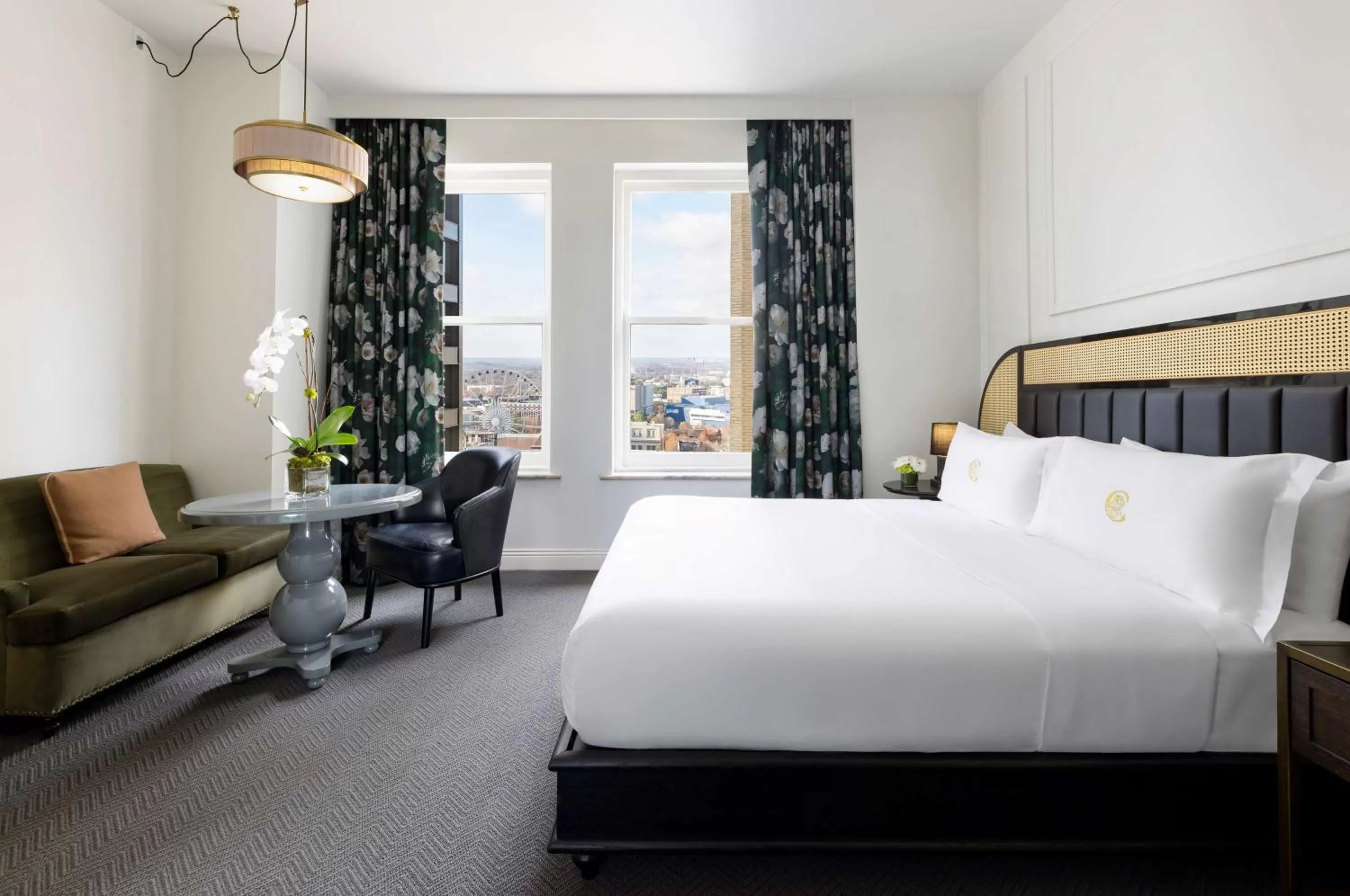 Living room, Bed in The Candler Hotel Atlanta, Curio Collection by Hilton