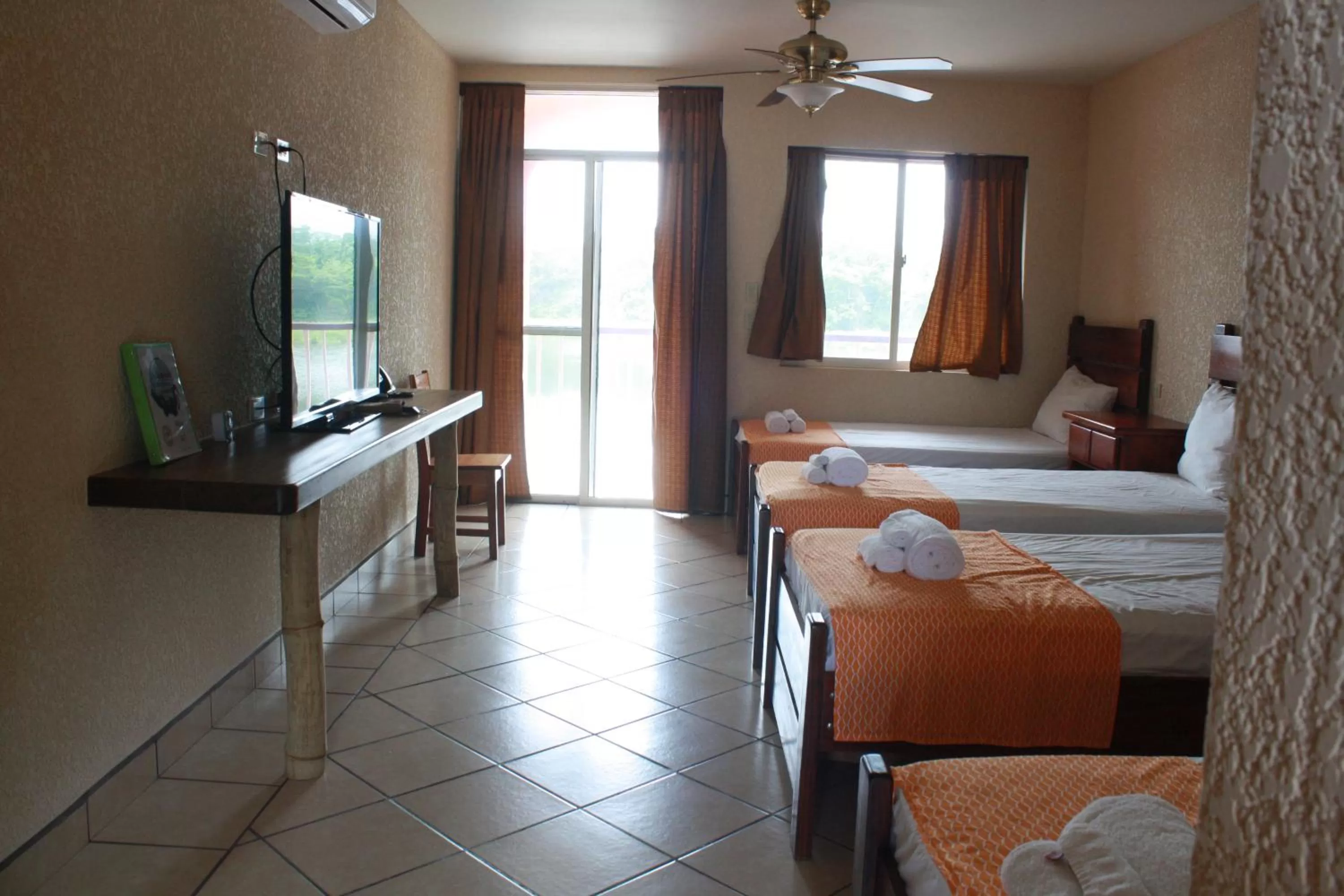 Bed in Lamanai Hotel & Marina