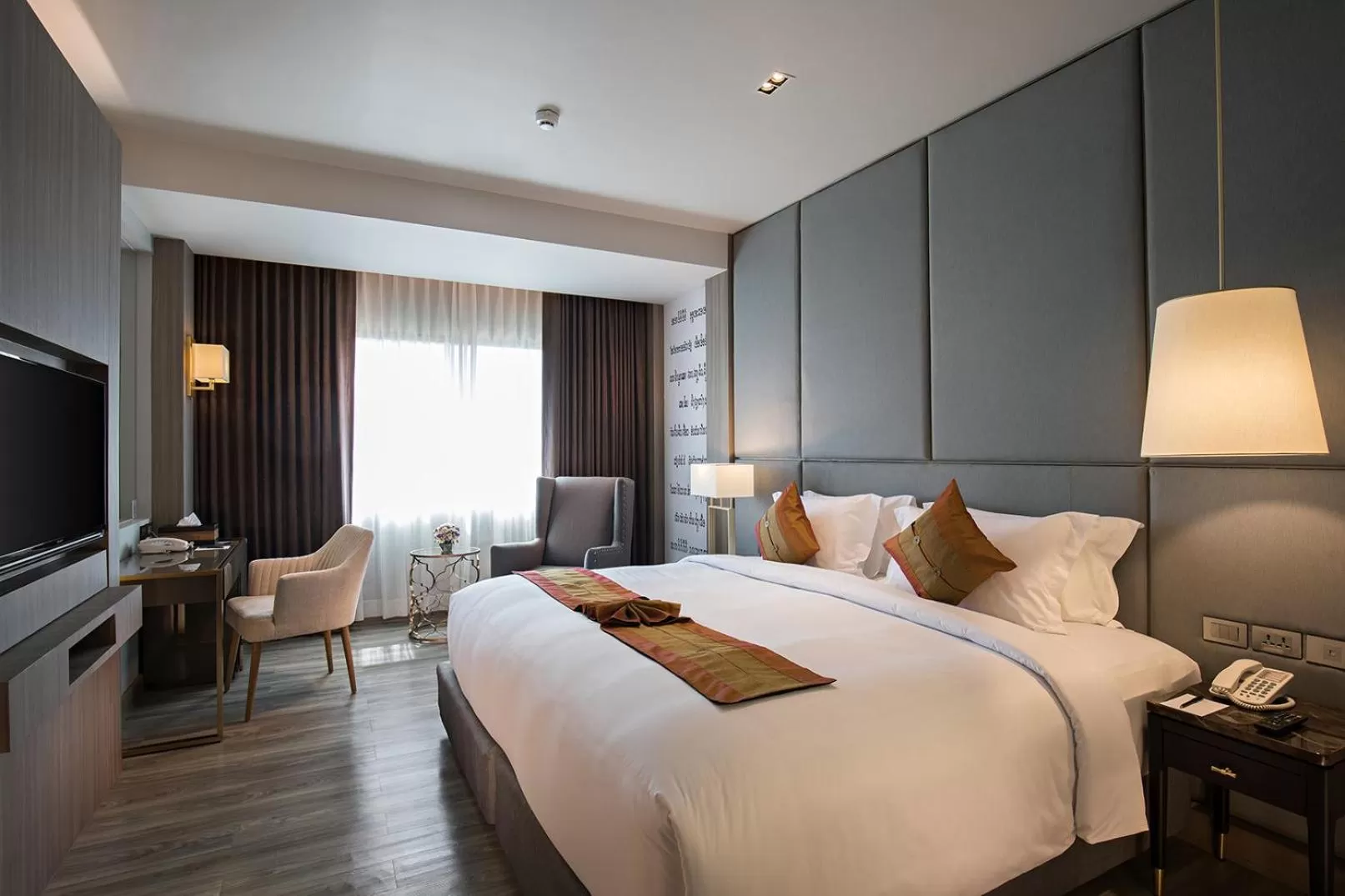 Bed in The Heritage Chiang Rai Hotel and Convention