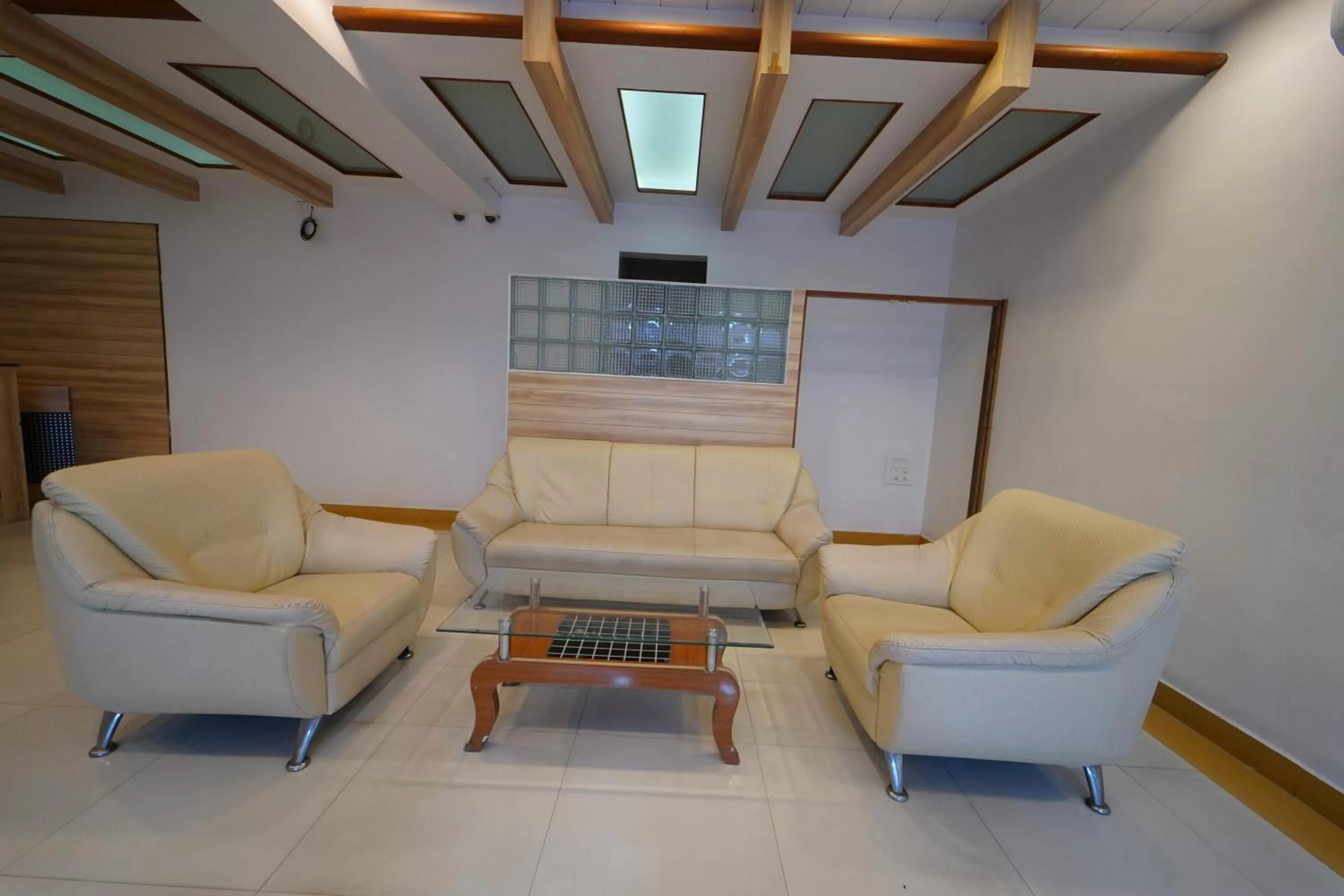 Seating area in Hotel Palmyra Grand Inn