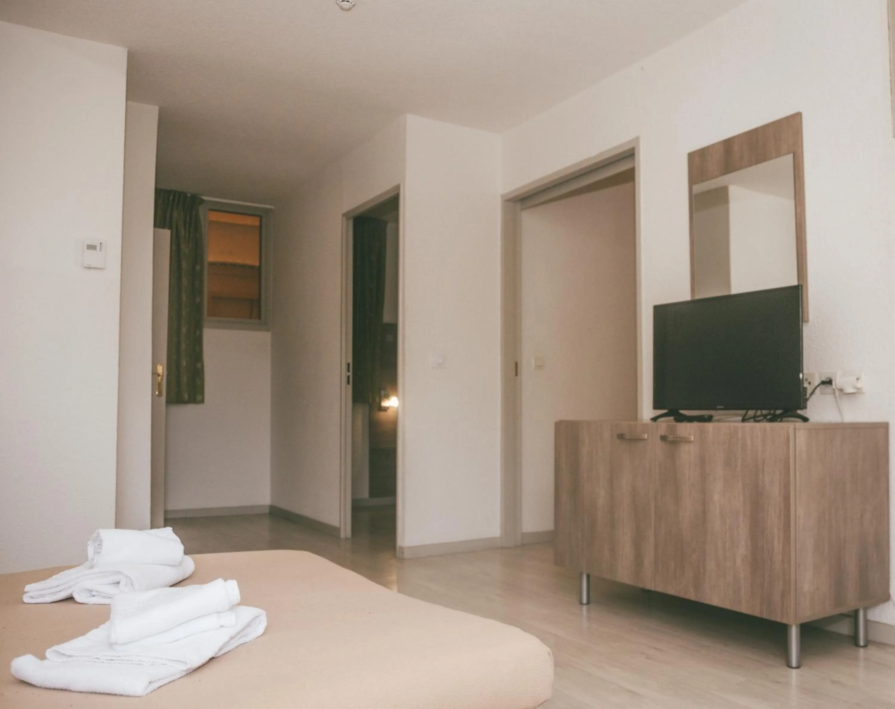 Bedroom, Bed in Terres de France - Appart'Hotel le Splendid