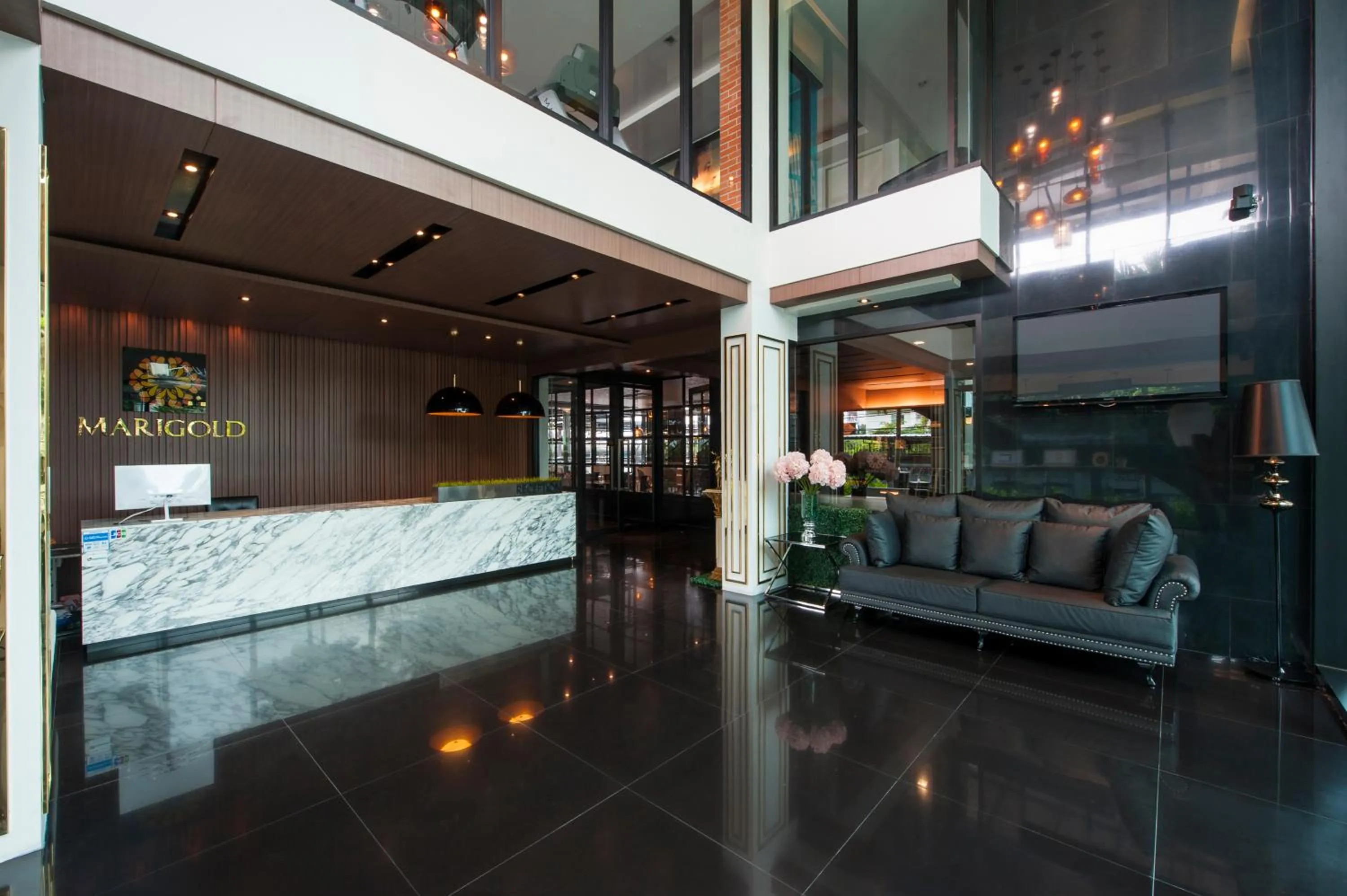 Lobby or reception in Marigold Sukhumvit - Free Shuttle to BTS Bearing Station