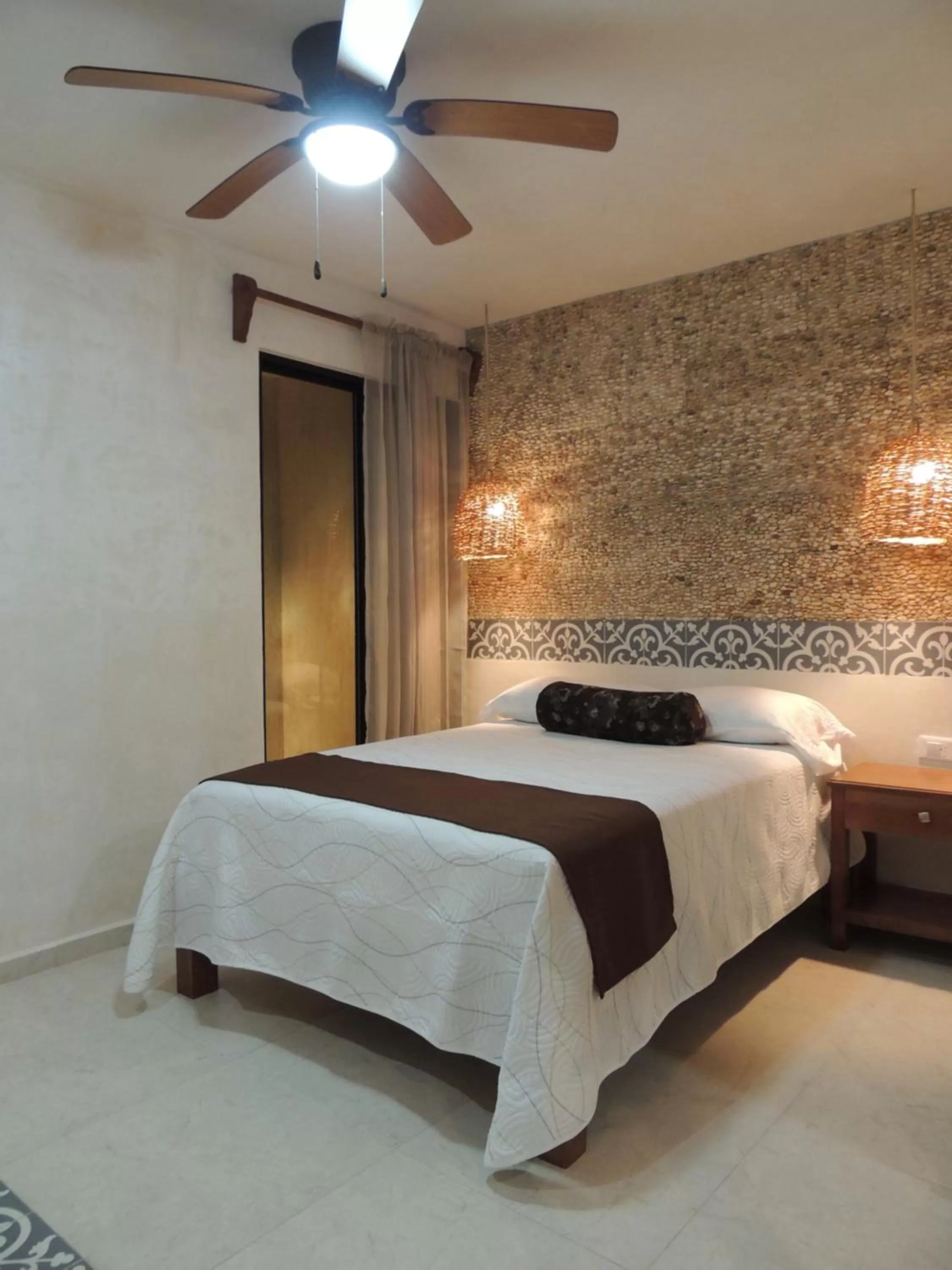 Bed in Hotel Boutique Bugambilias