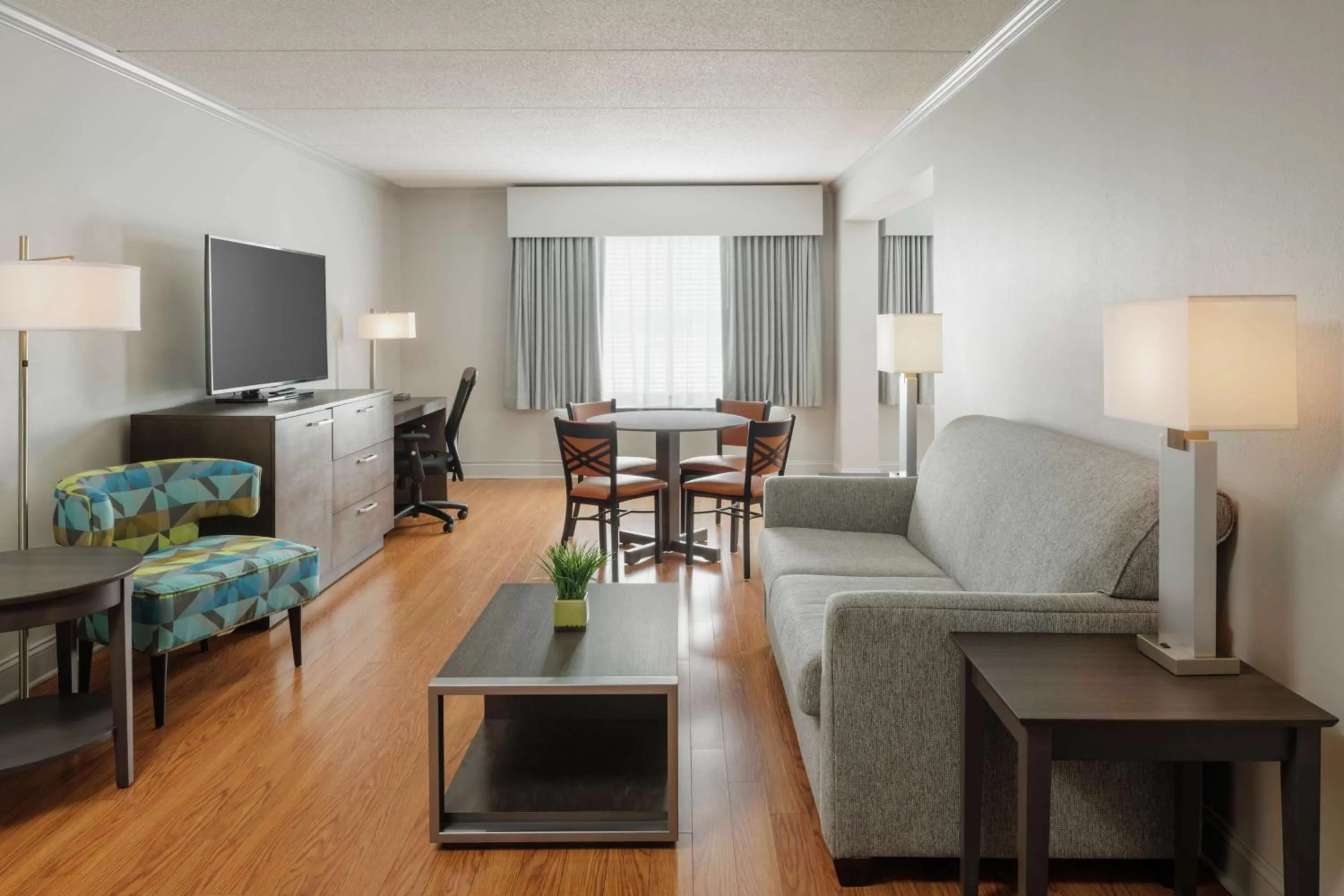 Living room in Hotel Trilogy Albany Airport, Tapestry Collection by Hilton