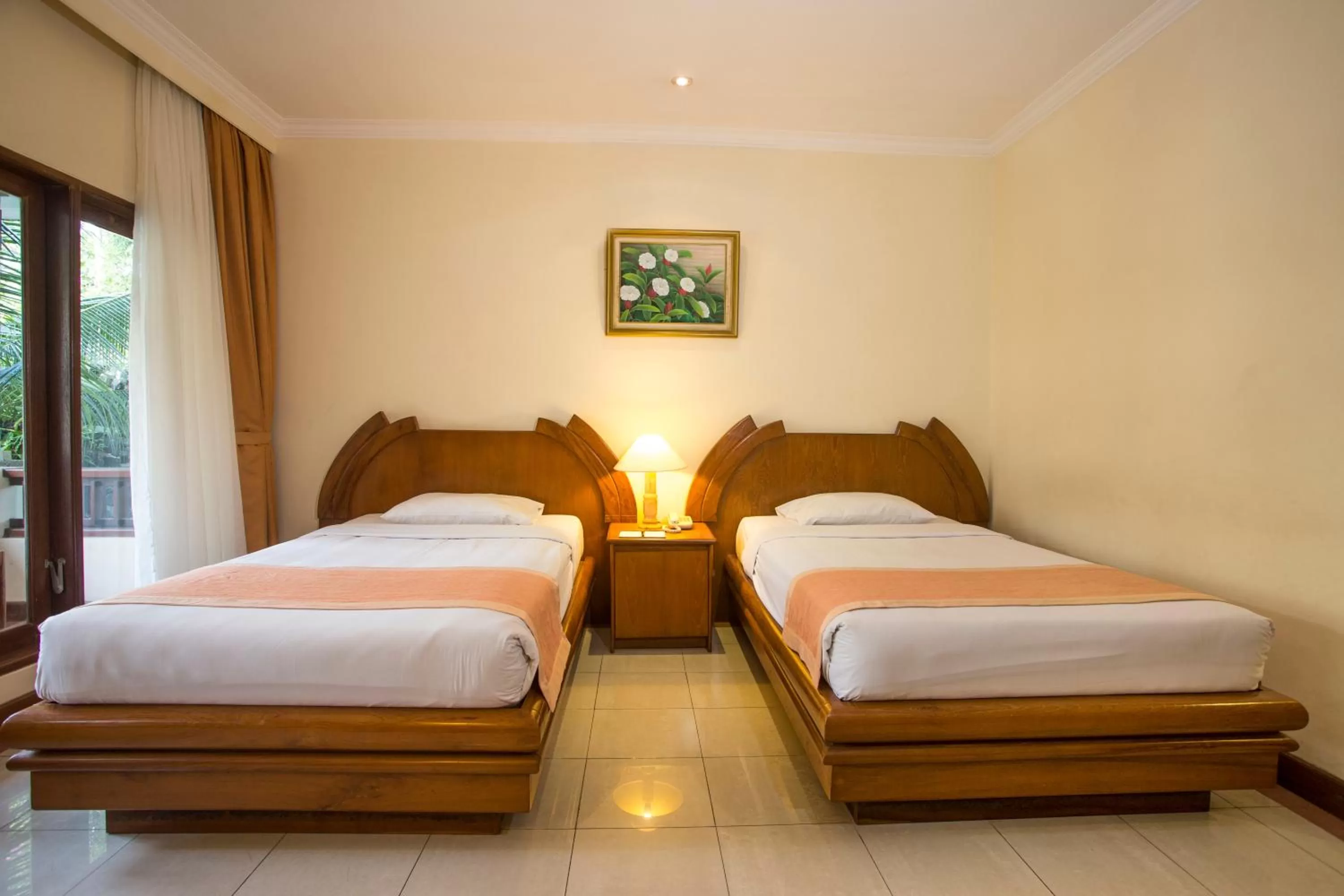 Bed in Parigata Resorts and Spa