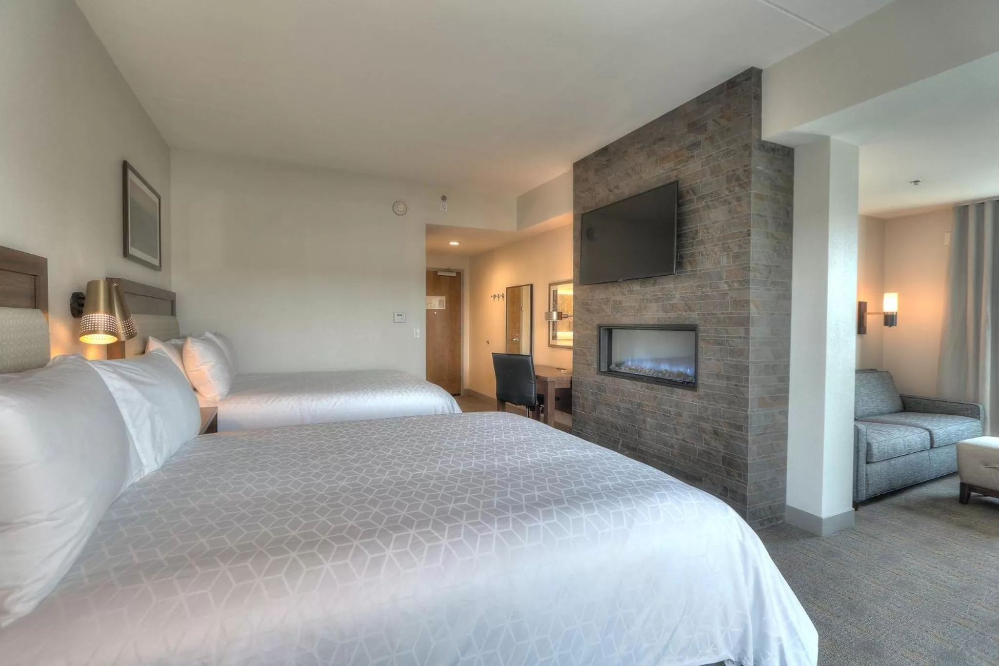 Photo of the whole room, Bed in Holiday Inn & Suites Pigeon Forge Convention Center by IHG