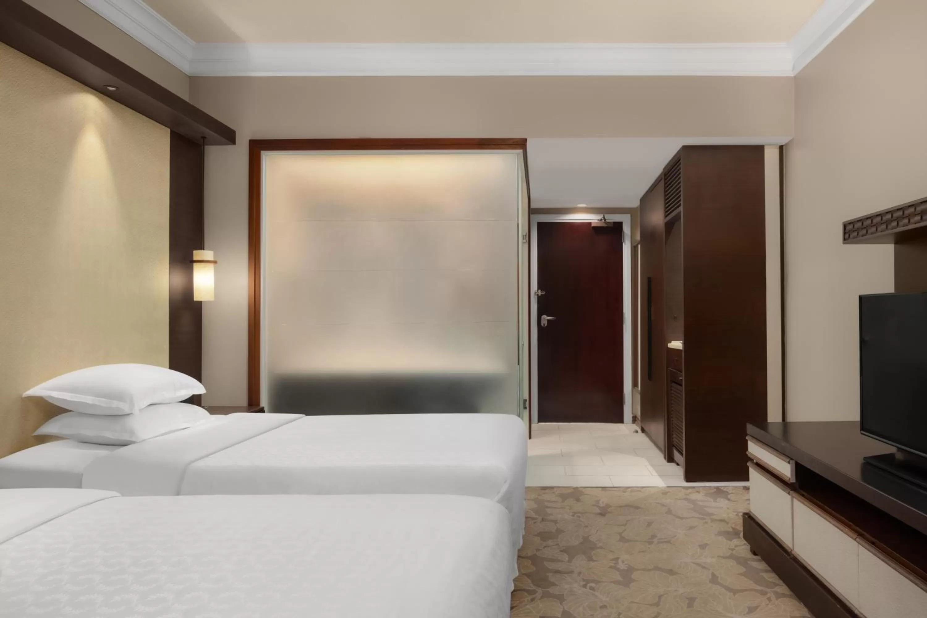 Bed in RIHGA Royal Laguna Guam Resort