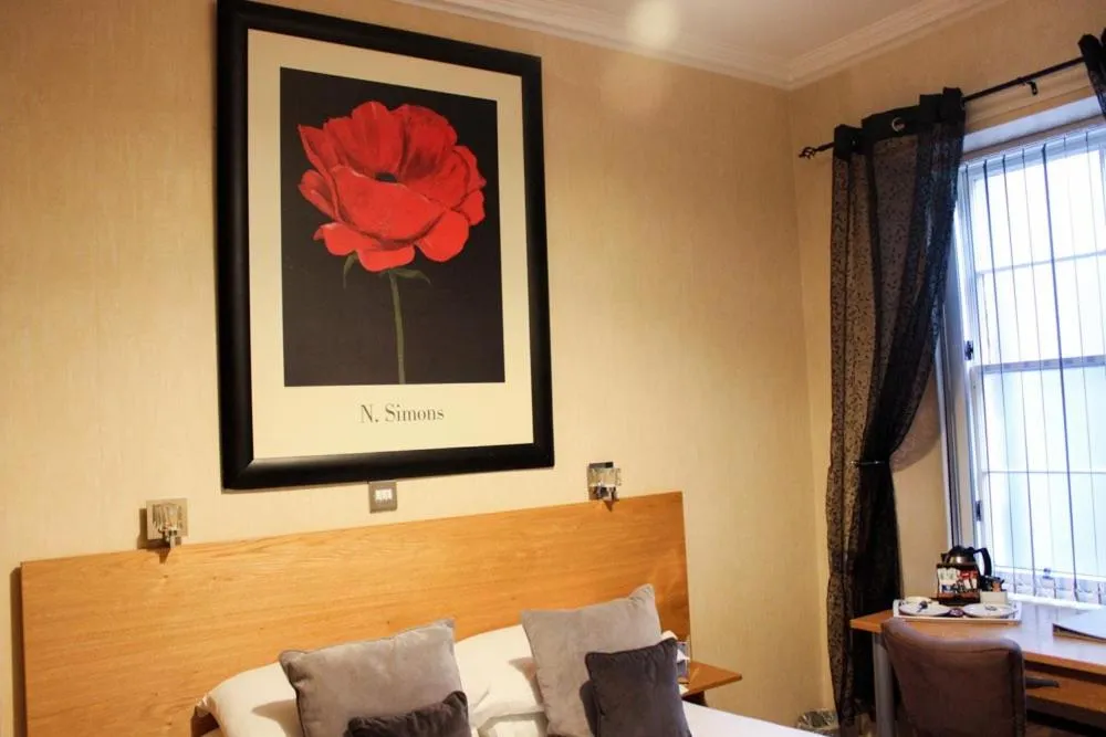 Bed in Station Hotel And Restaurant