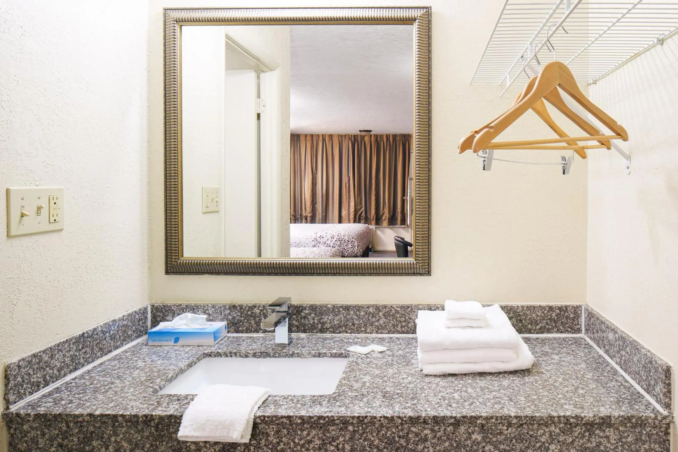 Bathroom in Americana Inn a Travelodge by Wyndham